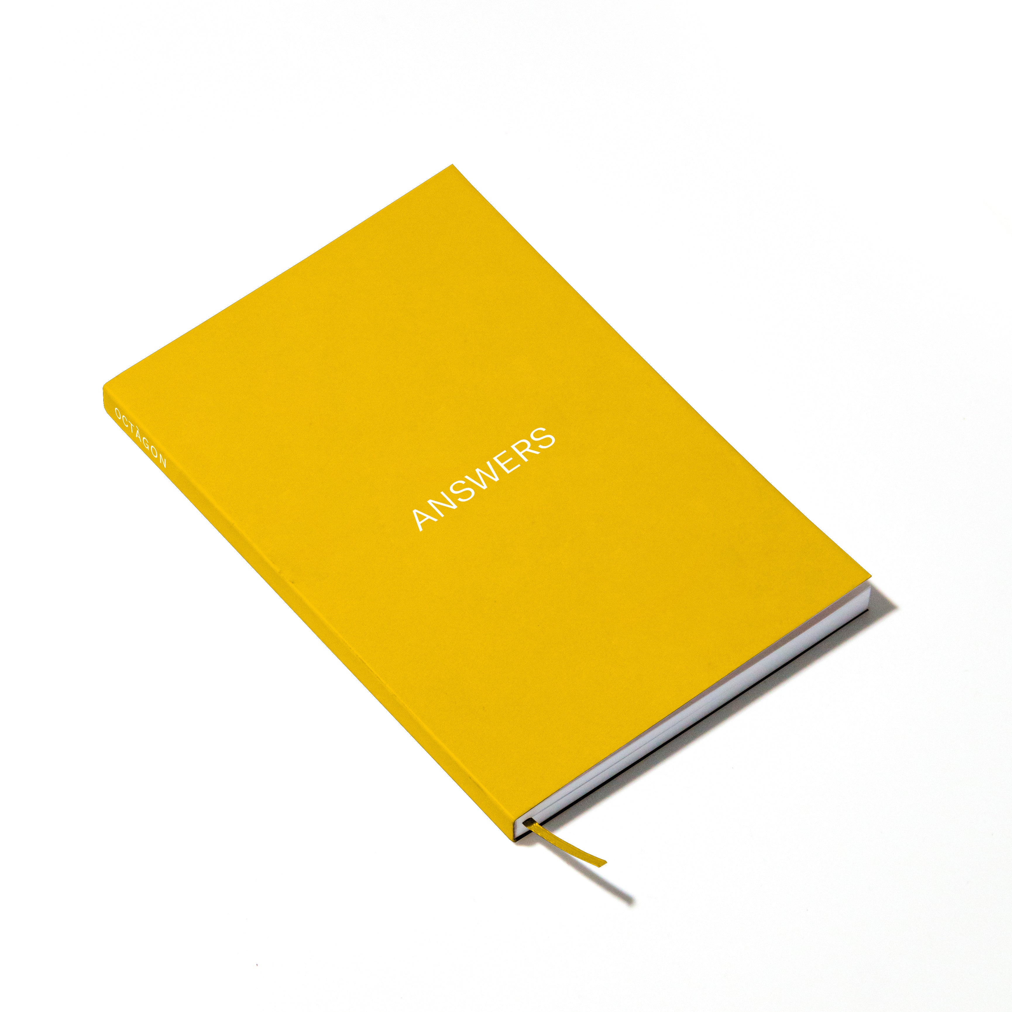 OCTÀGON DESIGN | Answers Notebook | Yellow cover and white typography.  