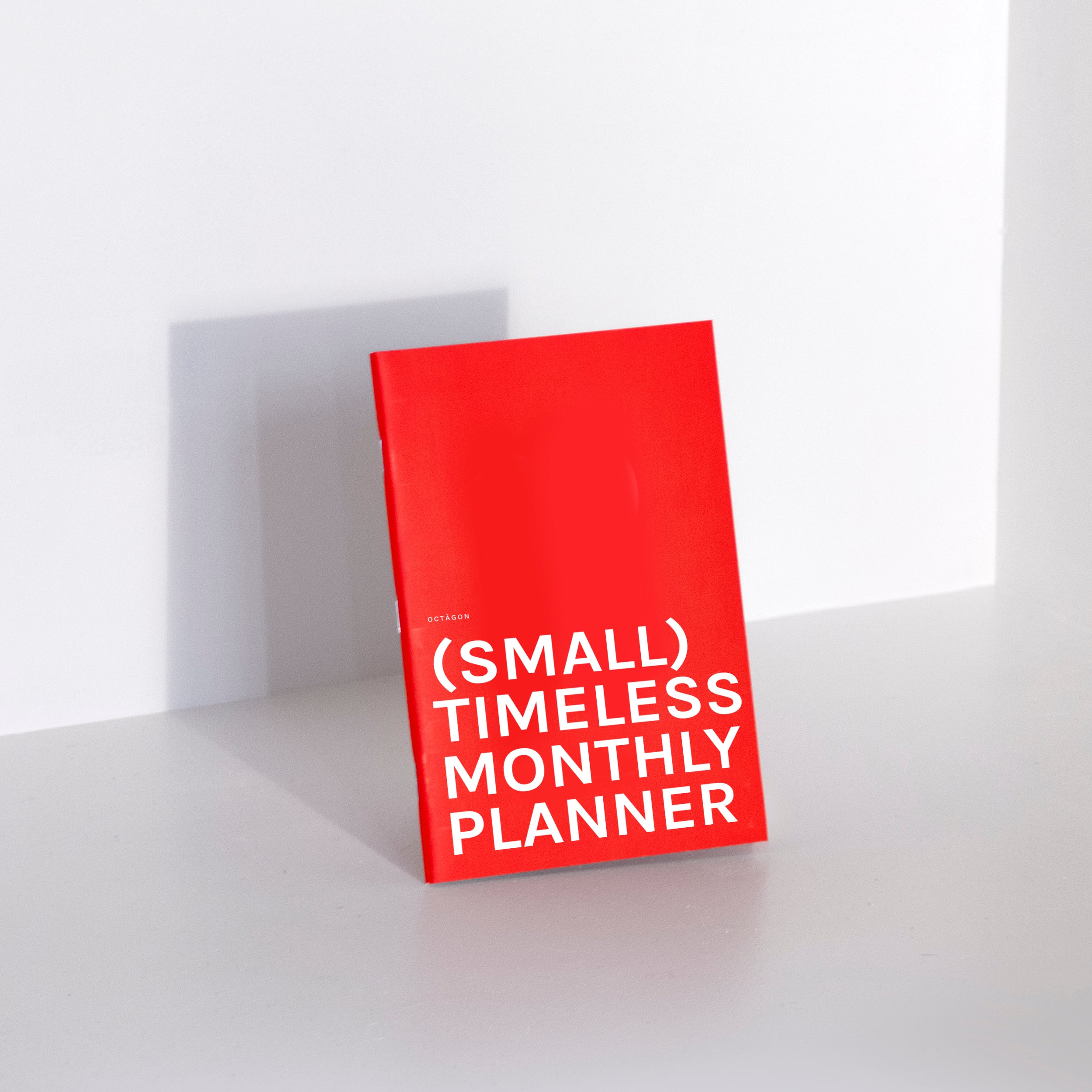 OCTÀGON DESIGN | "Monthly Planner | Similar A5 Size" timeless monthly planner, red color, white typography.