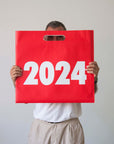 OCTÀGON DESIGN | 2024 Vinçon Wall Calendar | Red and white bag