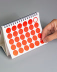 OCTÀGON DESIGN | 2024 Vinçon Desk Calendar | Page with round red stickers