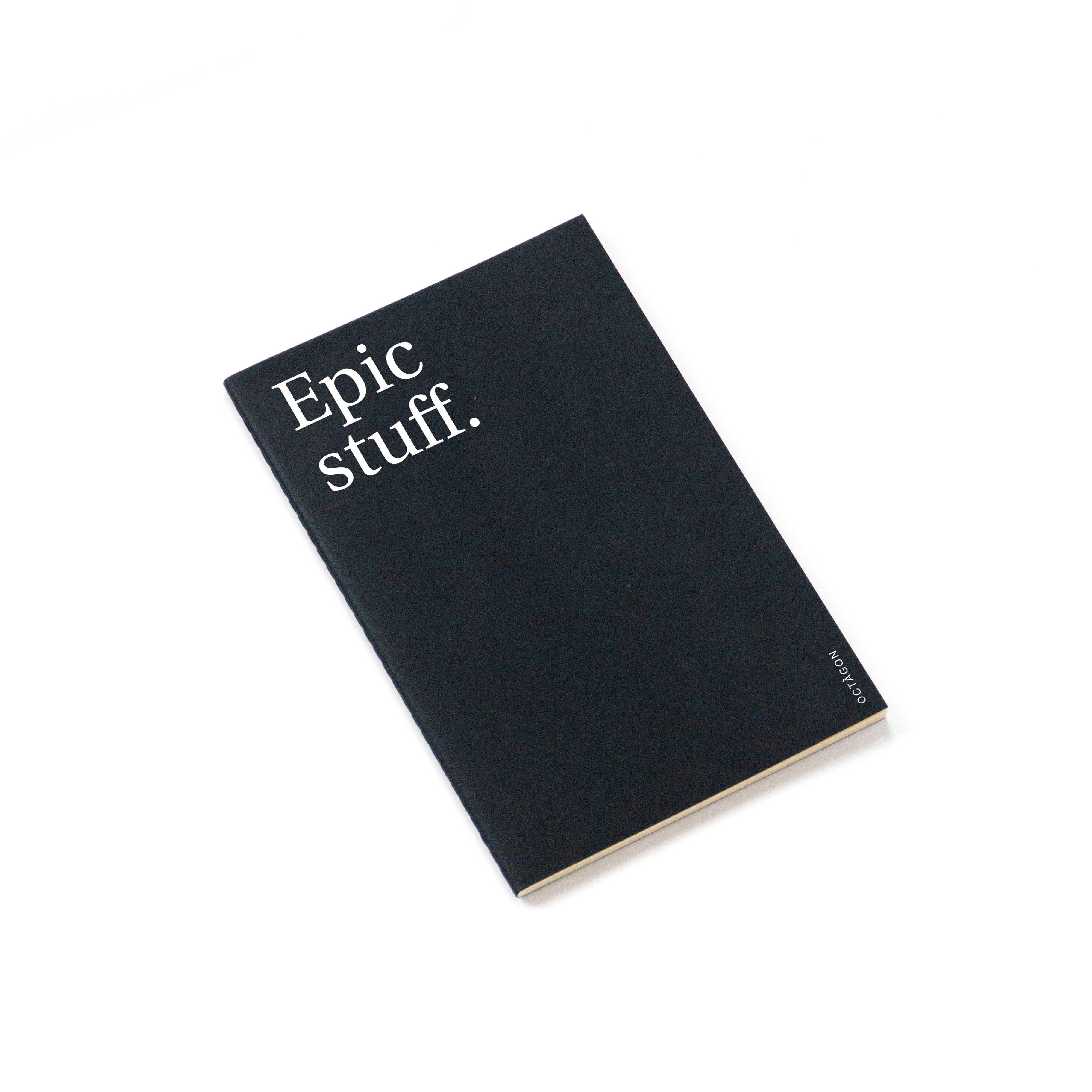"Epic stuff" thin notebook. Cover black color and white typography.