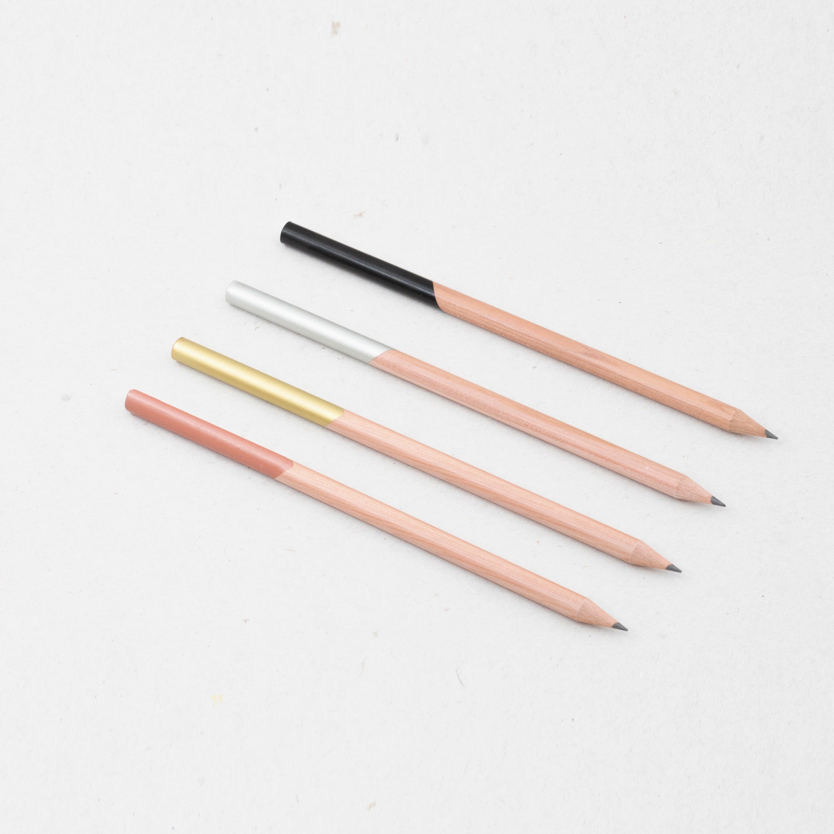 OCTÀGON DESIGN | Set of four wooden pencils copper, black, gold and silver color.