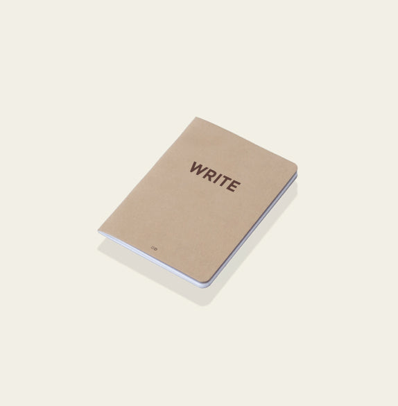 "Write" notebook on a white background. | Cuaderno "Write" sobre una superfície blanca. | Llibreta "Write" sobre una superfície blanca.