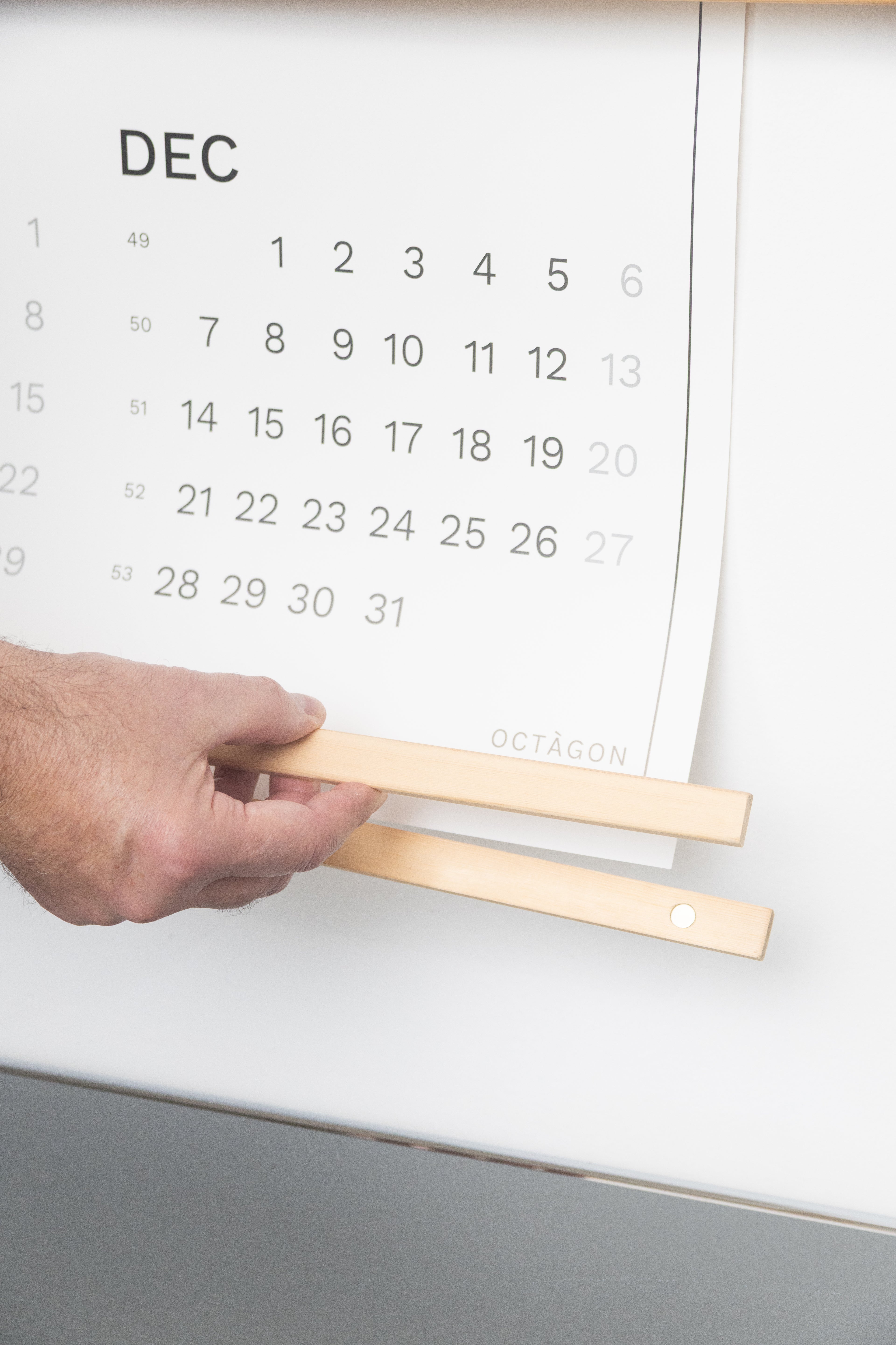 2027 Wall Calendar by Octàgon Design. Date Markers. Calendar hanger detail.