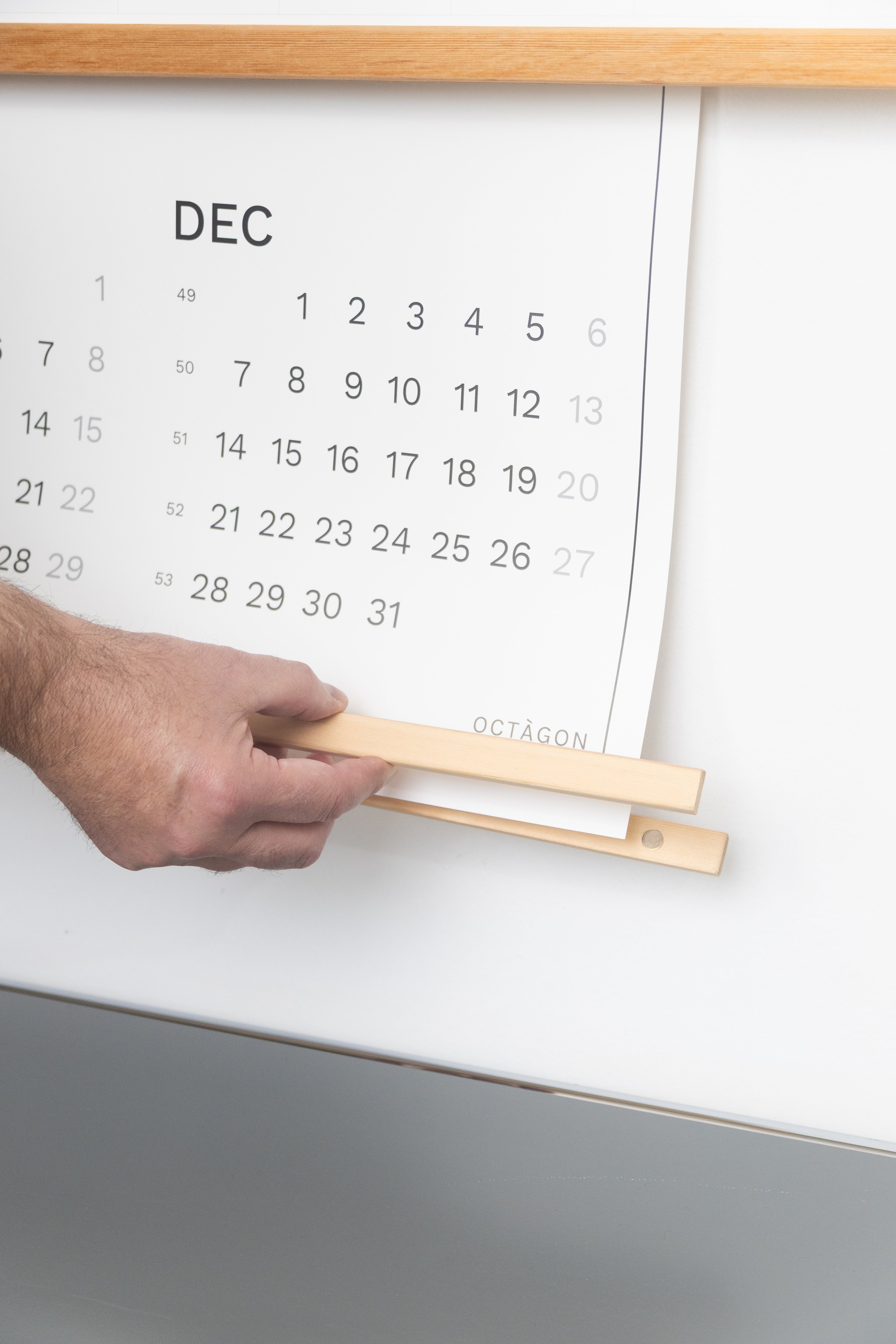 2027 Wall Calendar by Octàgon Design. Calendar hanger.
