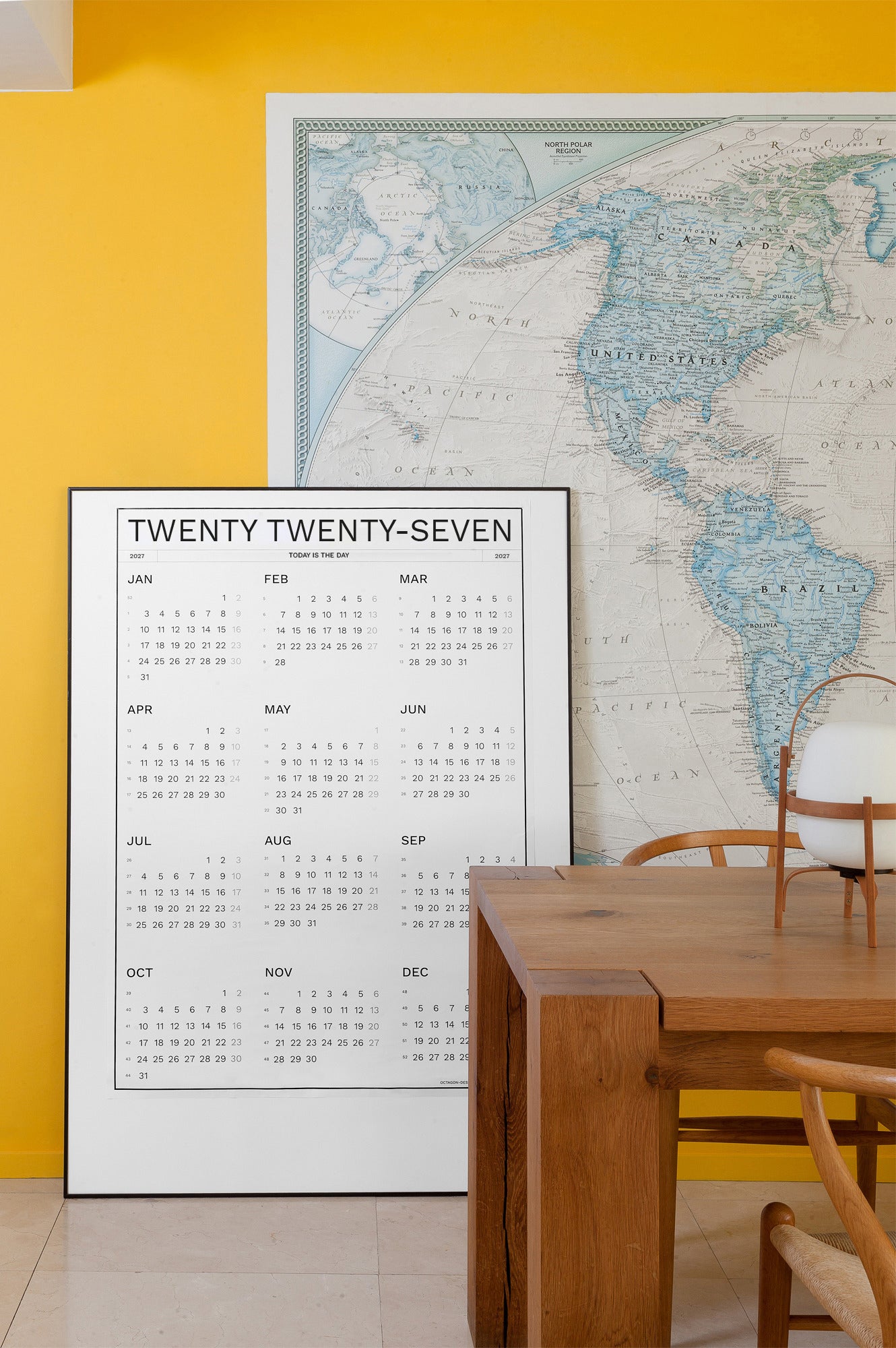 2027 Wall Calendar by Octàgon Design in a home atmosphere.