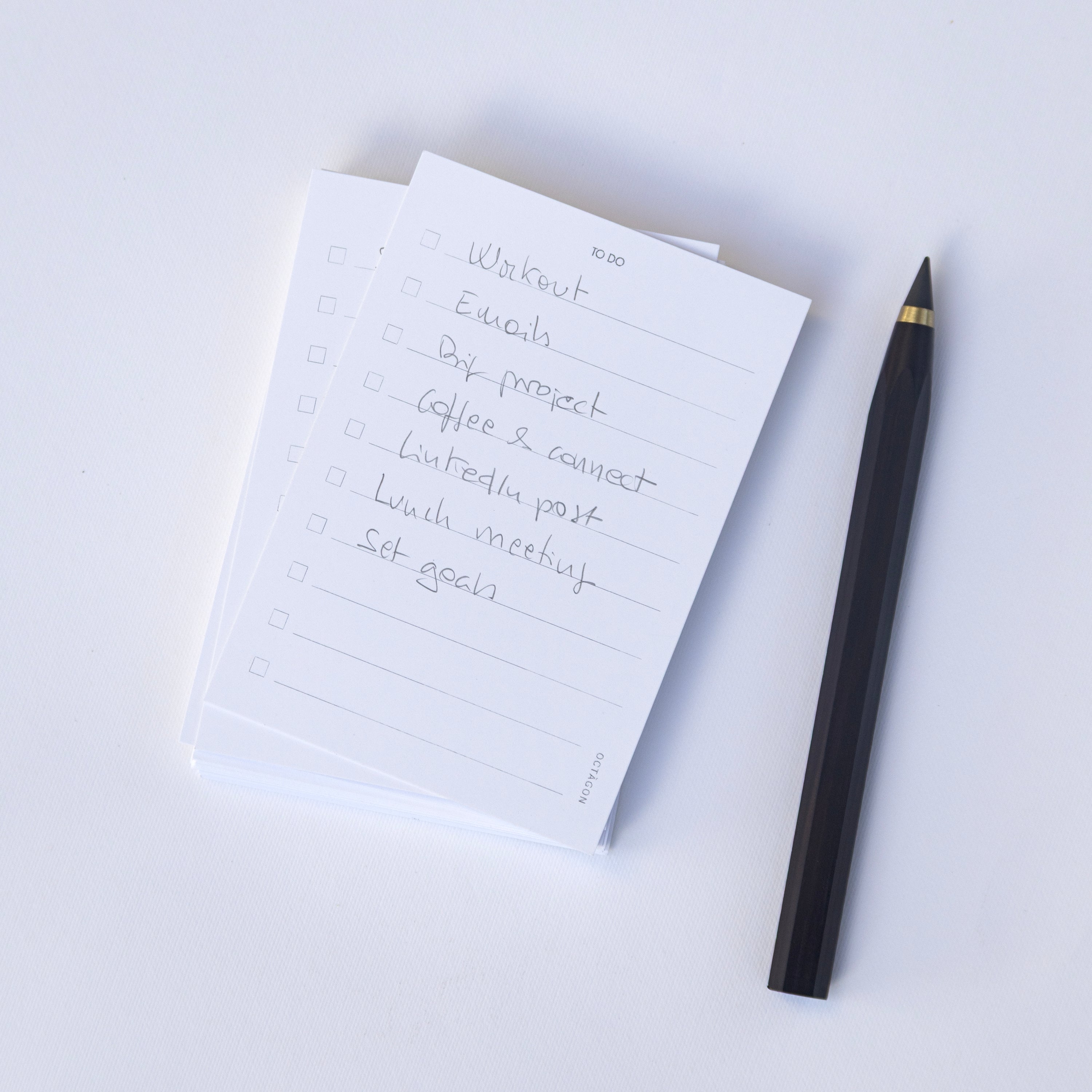 Min Cards – To Do / Notes and Octàgon Eternal Pencil on a white notepad with handwritten text on a white background