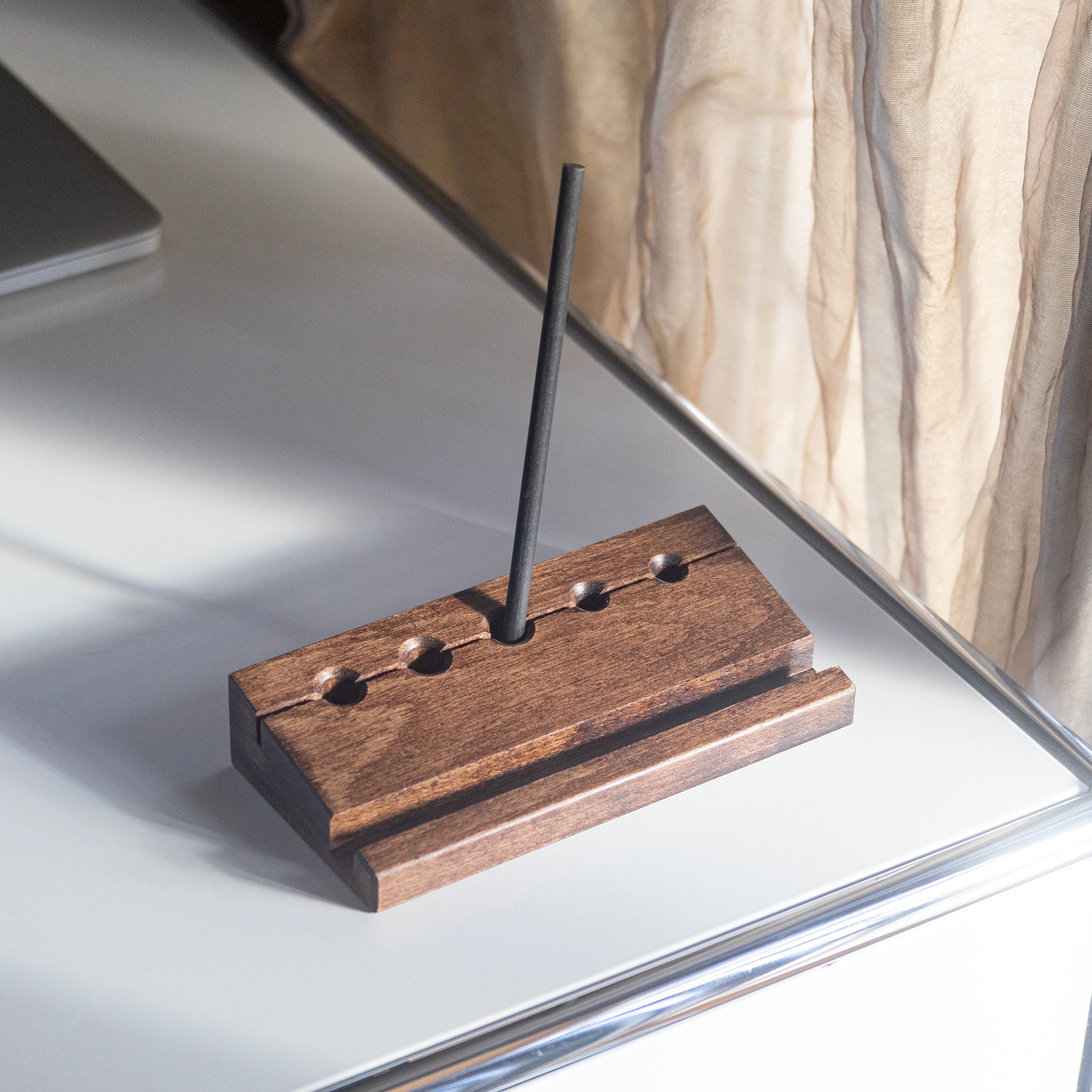 Min Prism wooden pencil holder with a pencil on a reflective surface