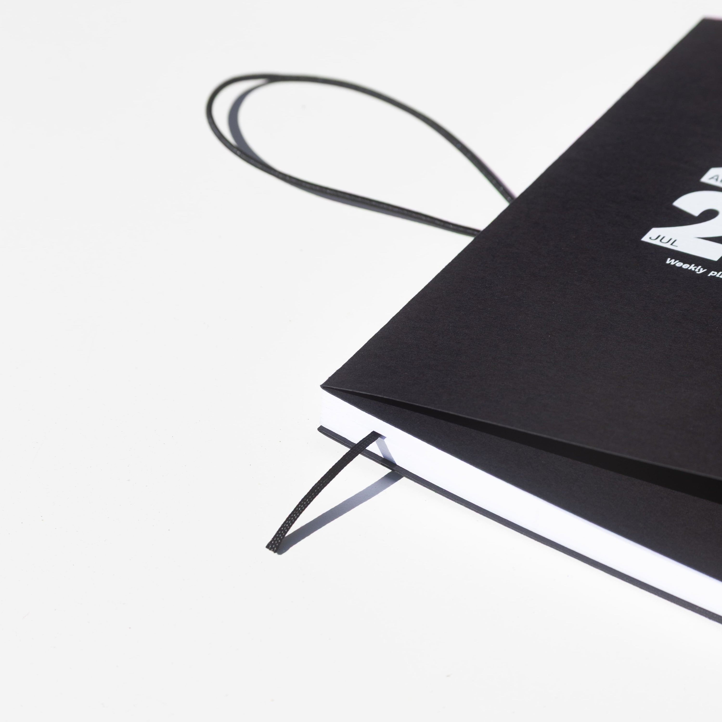 2026-2027 Academic Weekly Planner black with exposed spine and elastic band - Octàgon Design