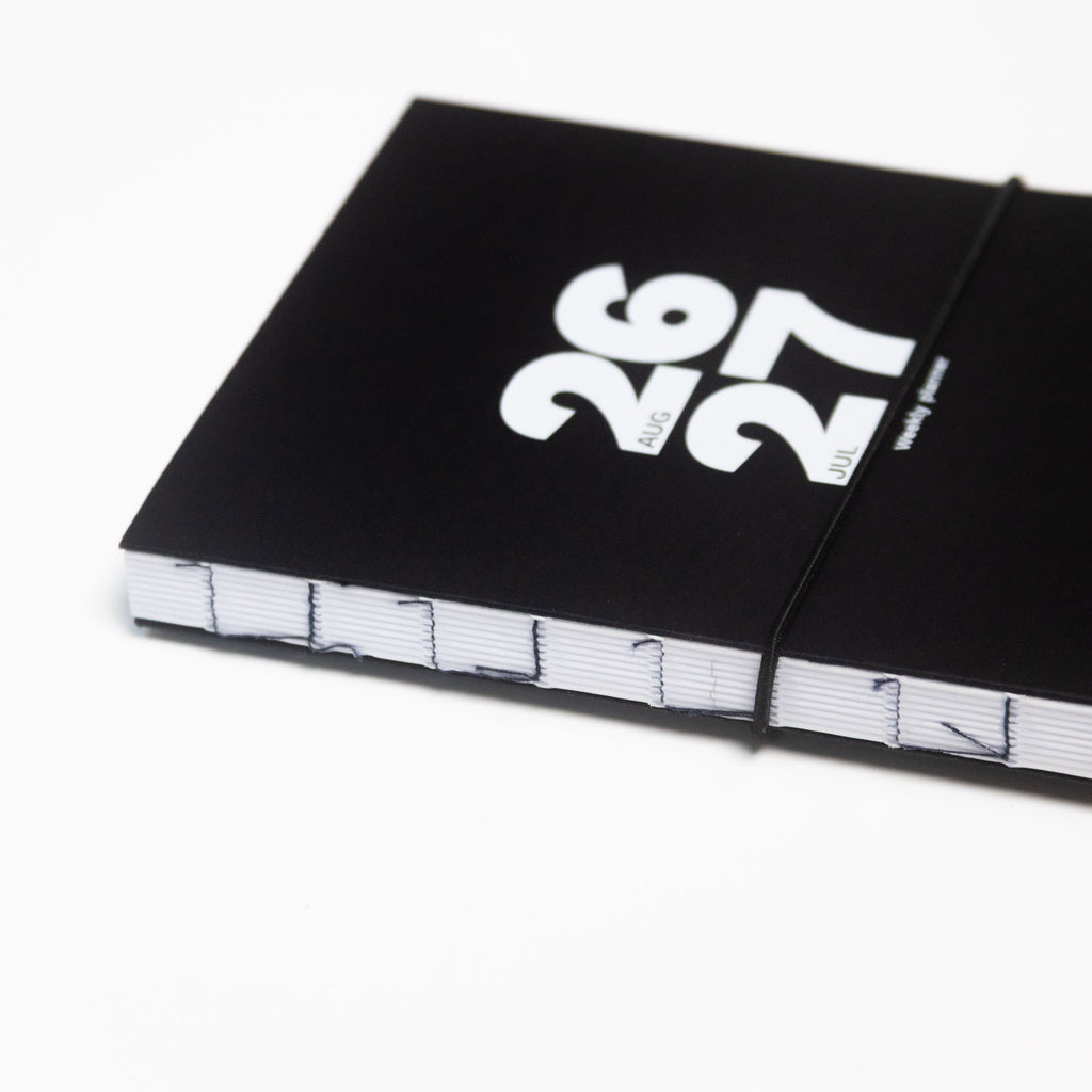 2026-2027 Academic Weekly Planner black with exposed spine and elastic band - Octàgon Design