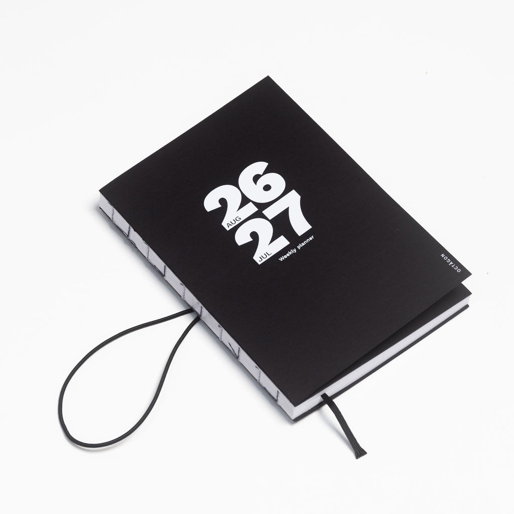 2026-2027 Academic Weekly Planner black with exposed spine and elastic band - Octàgon Design
