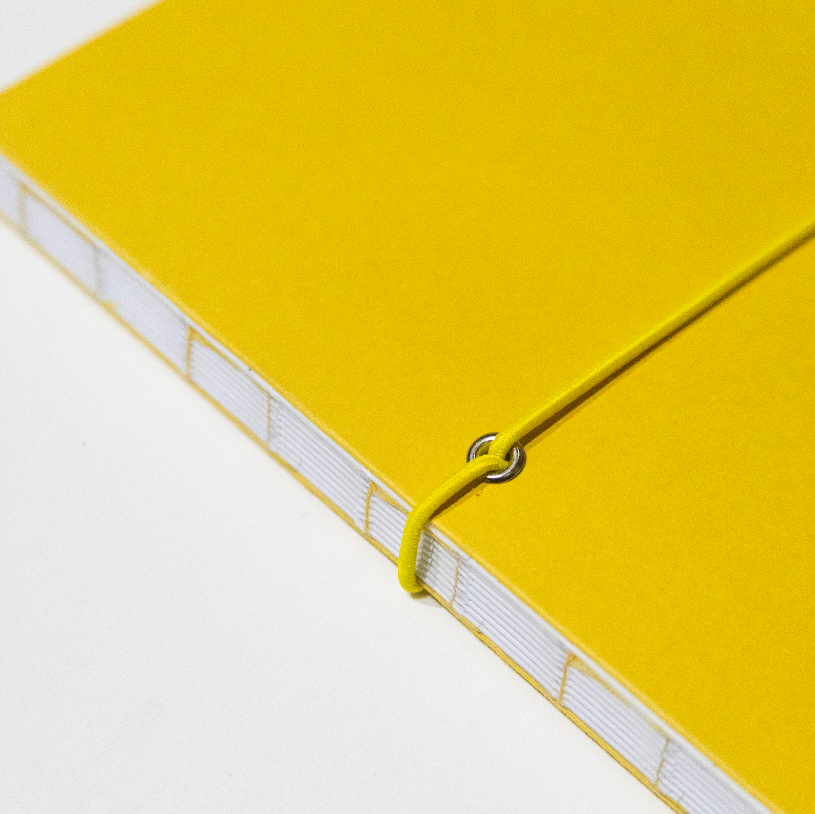 2026-2027 Academic Weekly Planner Indian Yellow with exposed spine and elastic band - Octàgon Design