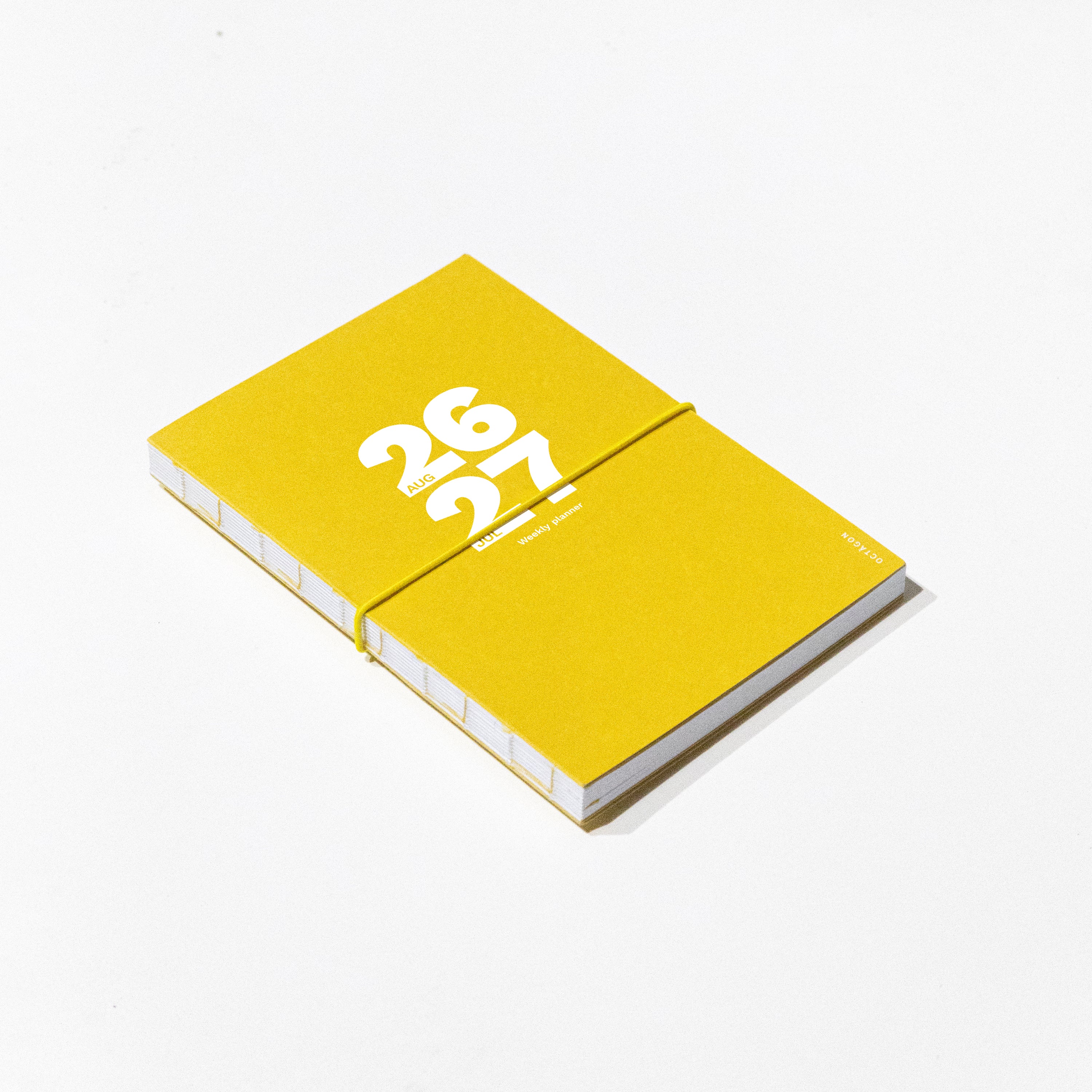 2026-2027 Academic Weekly Planner Indian Yellow with exposed spine and elastic band - Octàgon Design
