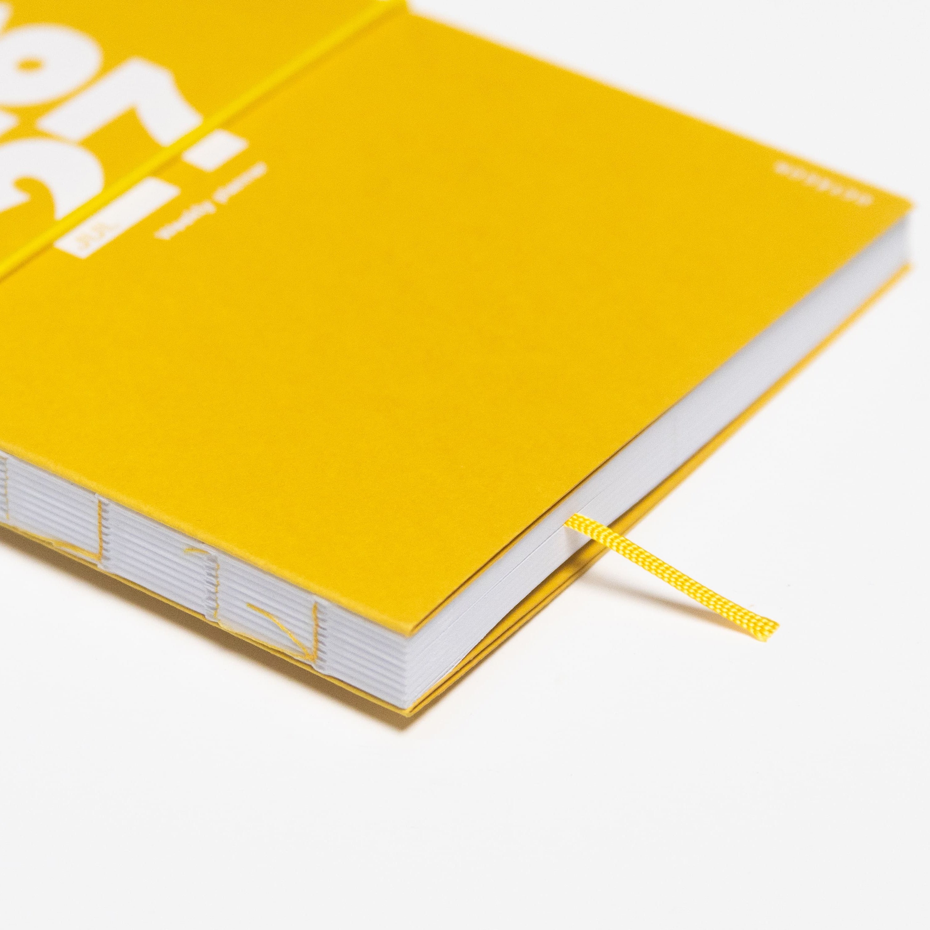 2026-2027 Academic Weekly Planner Indian Yellow cover detail - Octàgon Design