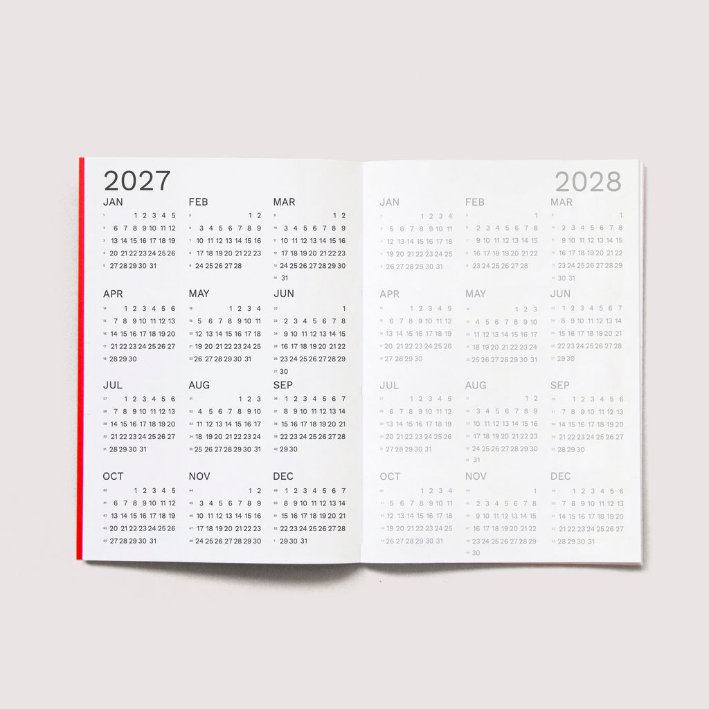 The iconic Mini Monthly Planner similar A6 size by Octàgon Design.  2027 and 2028 Calendars.