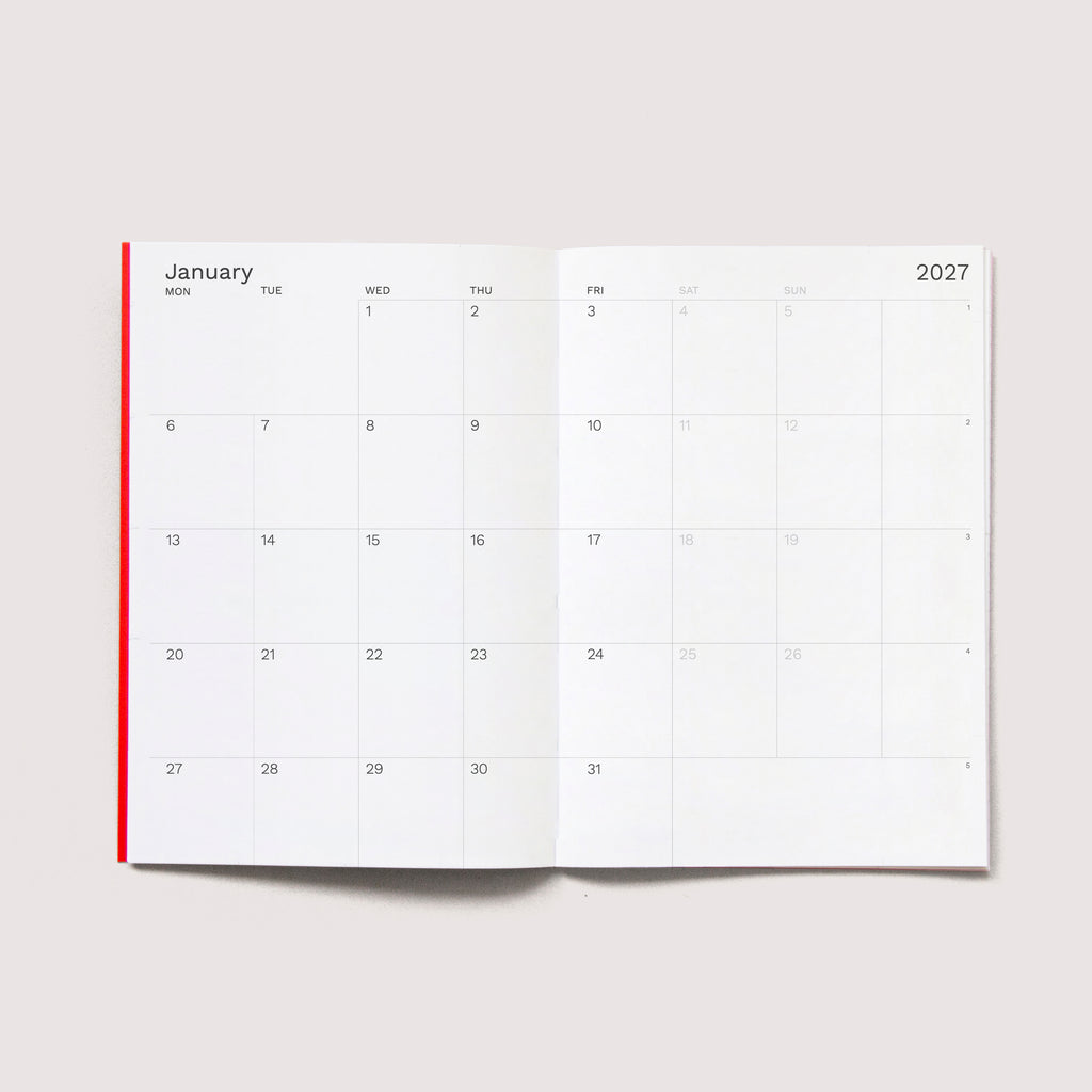 The iconic Mini Monthly Planner similar A6 size by Octàgon Design.  Monthly view.