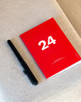 OCTÀGON DESIGN | "2024 Monthly Planner Similar A6 size" monthly planner, red color, white typography.