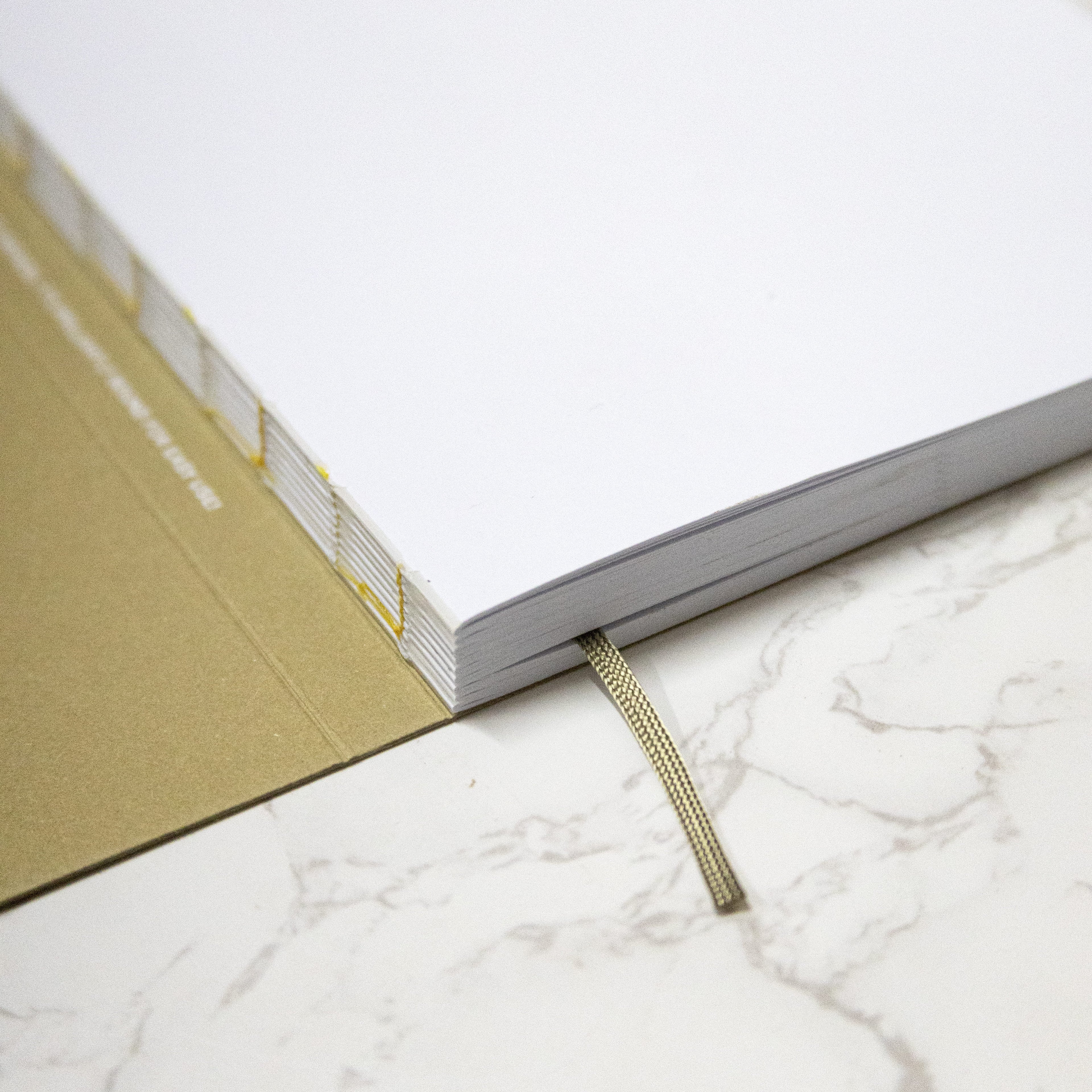 2026 Weekly Planner, best planner. From Octàgon Design. Camel cover. Binding detail.