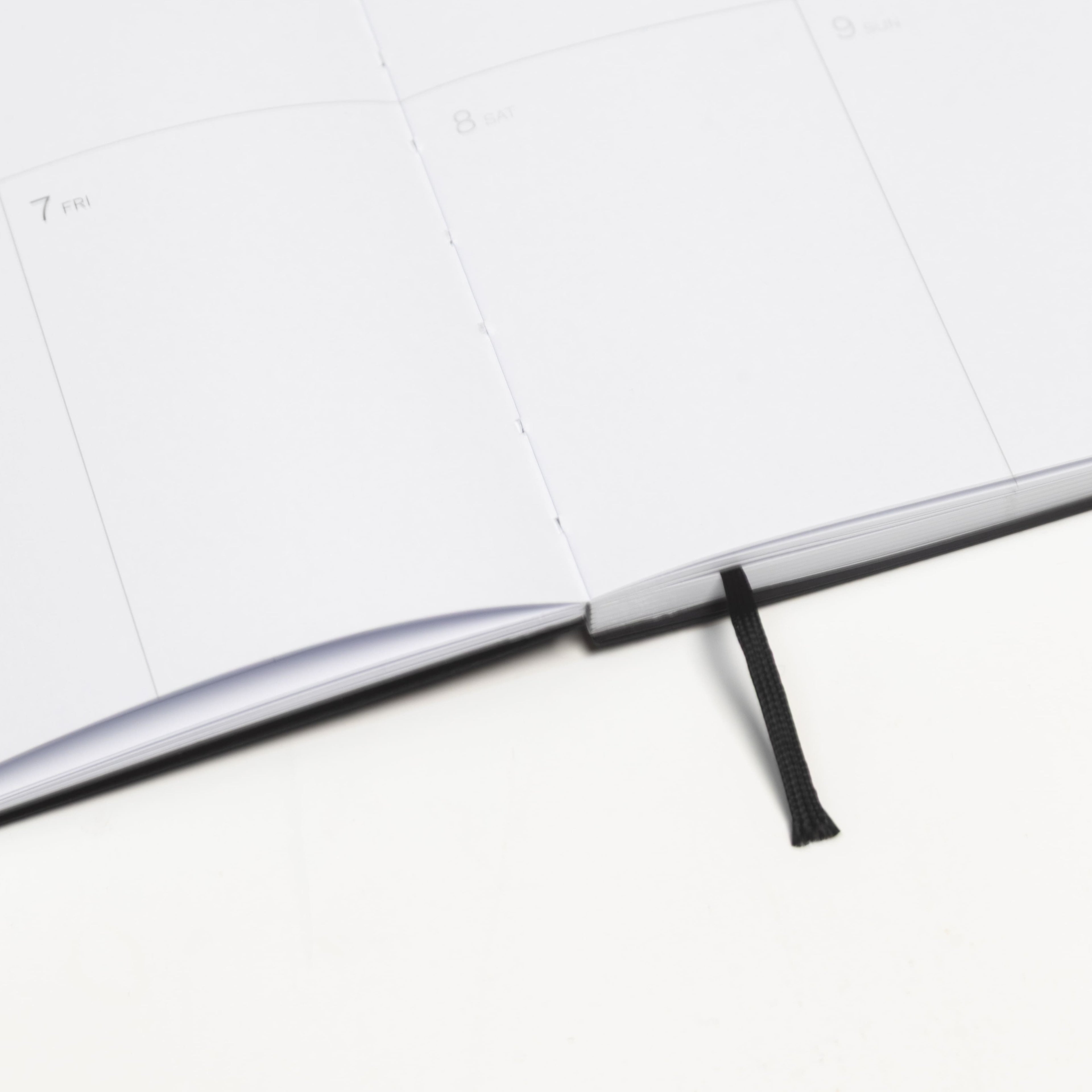 2027 Weekly Planner A5 by Octàgon Design. Black color. Exposed spine detail.