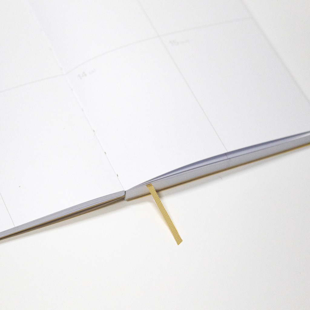 2027 Weekly Planner A5 by Octàgon Design. Camel color. Exposed spine detail.
