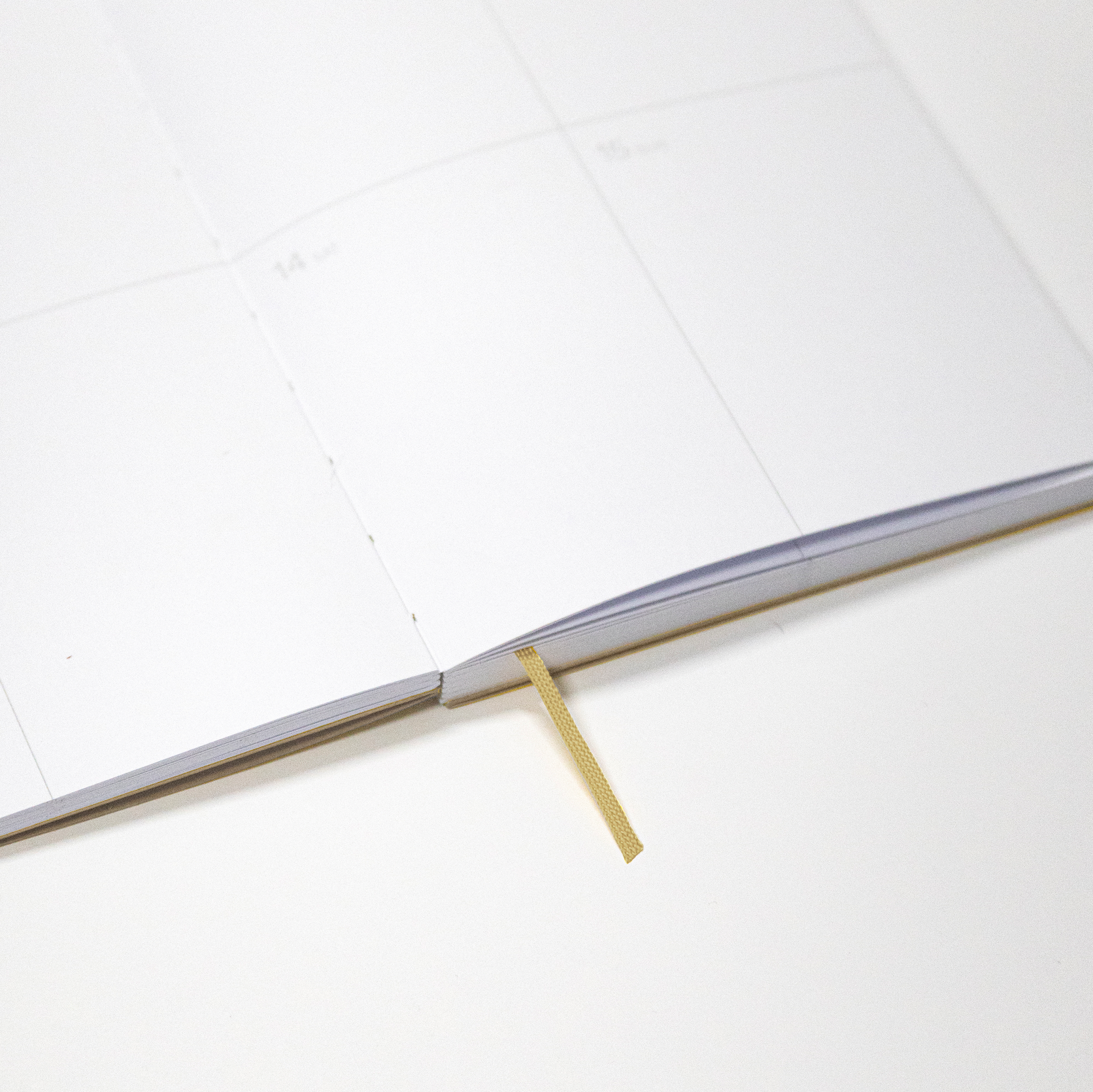 2027 Weekly Planner A5 by Octàgon Design. Camel color. Exposed spine detail.