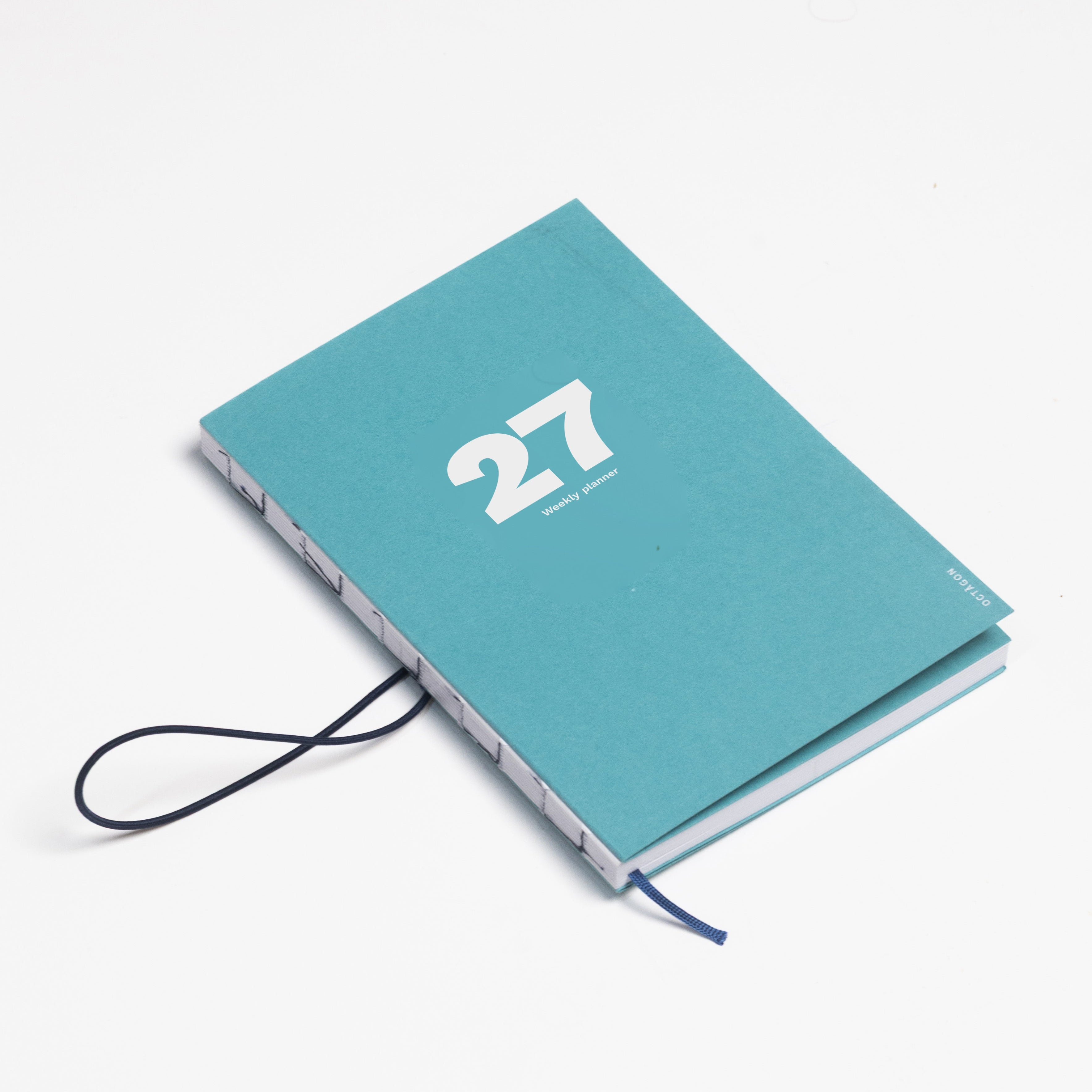 2027 Weekly Planner A5 by Octàgon Design. Caribbean Blue color. Elastic band detail. 