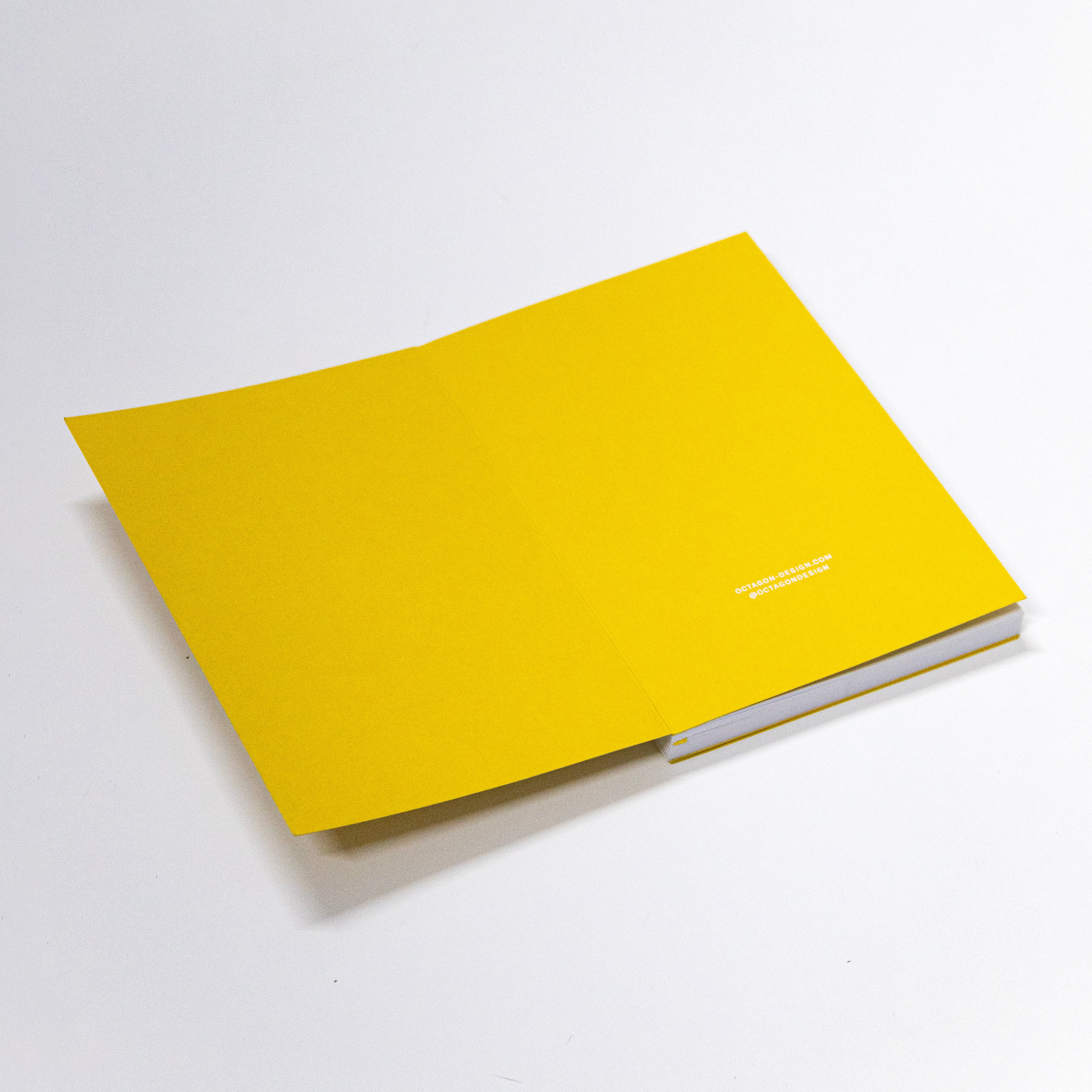 2027 Weekly Planner A5 by Octàgon Design. Yellow color. Exposed spine detail.
