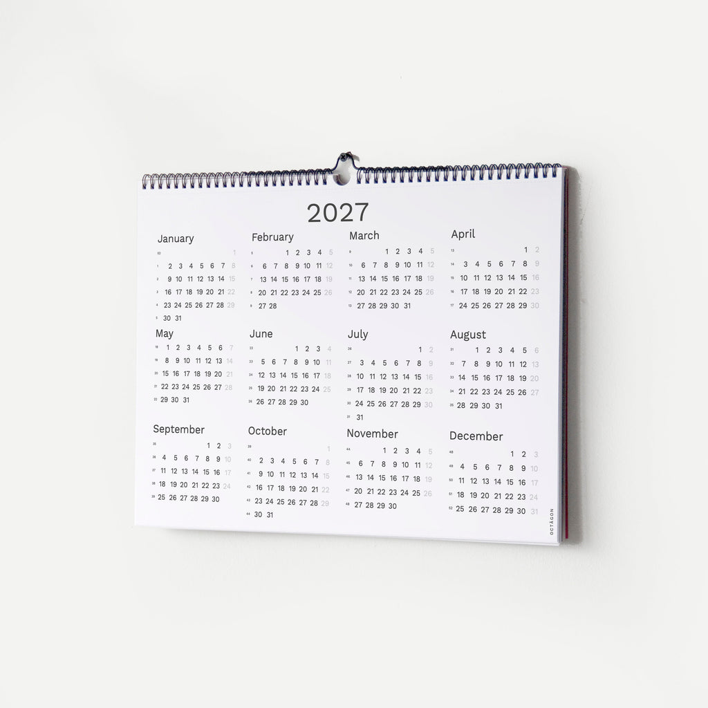 2027 Wall Planner by Octàgon Design. The calendar hanging on the wall showing the 2027 calendar page.