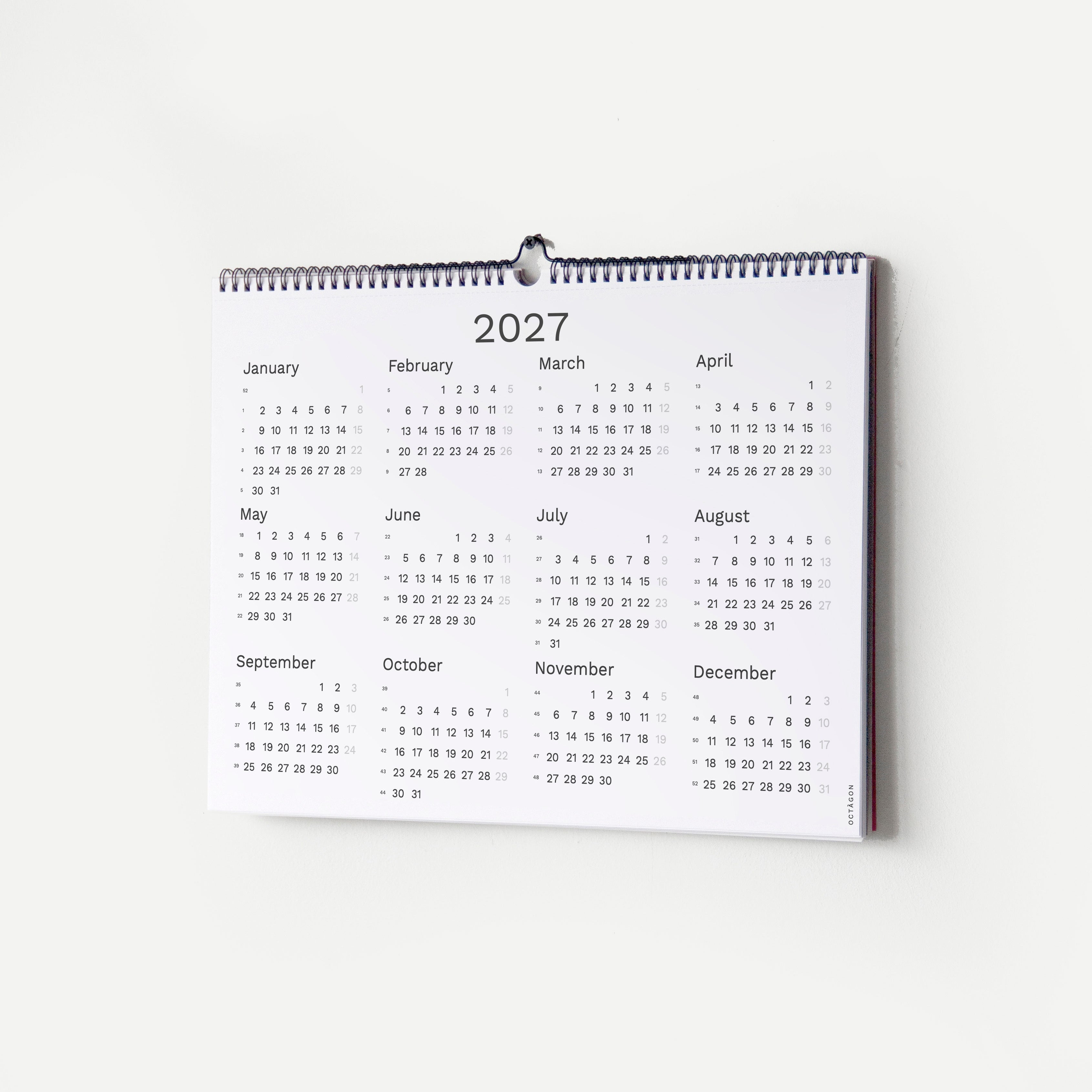 2027 Wall Planner by Octàgon Design. The calendar hanging on the wall showing the 2027 calendar page.