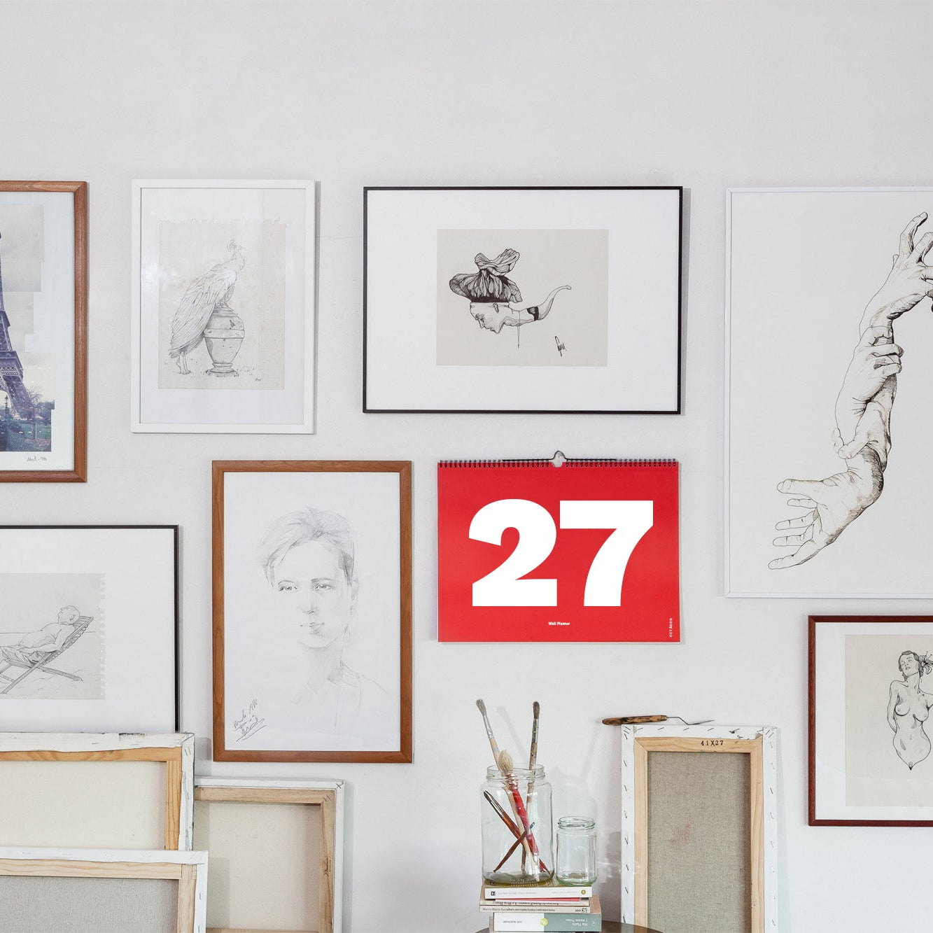 2027 Wall Planner by Octàgon Design. The calendar on the wall among beautiful pictures.