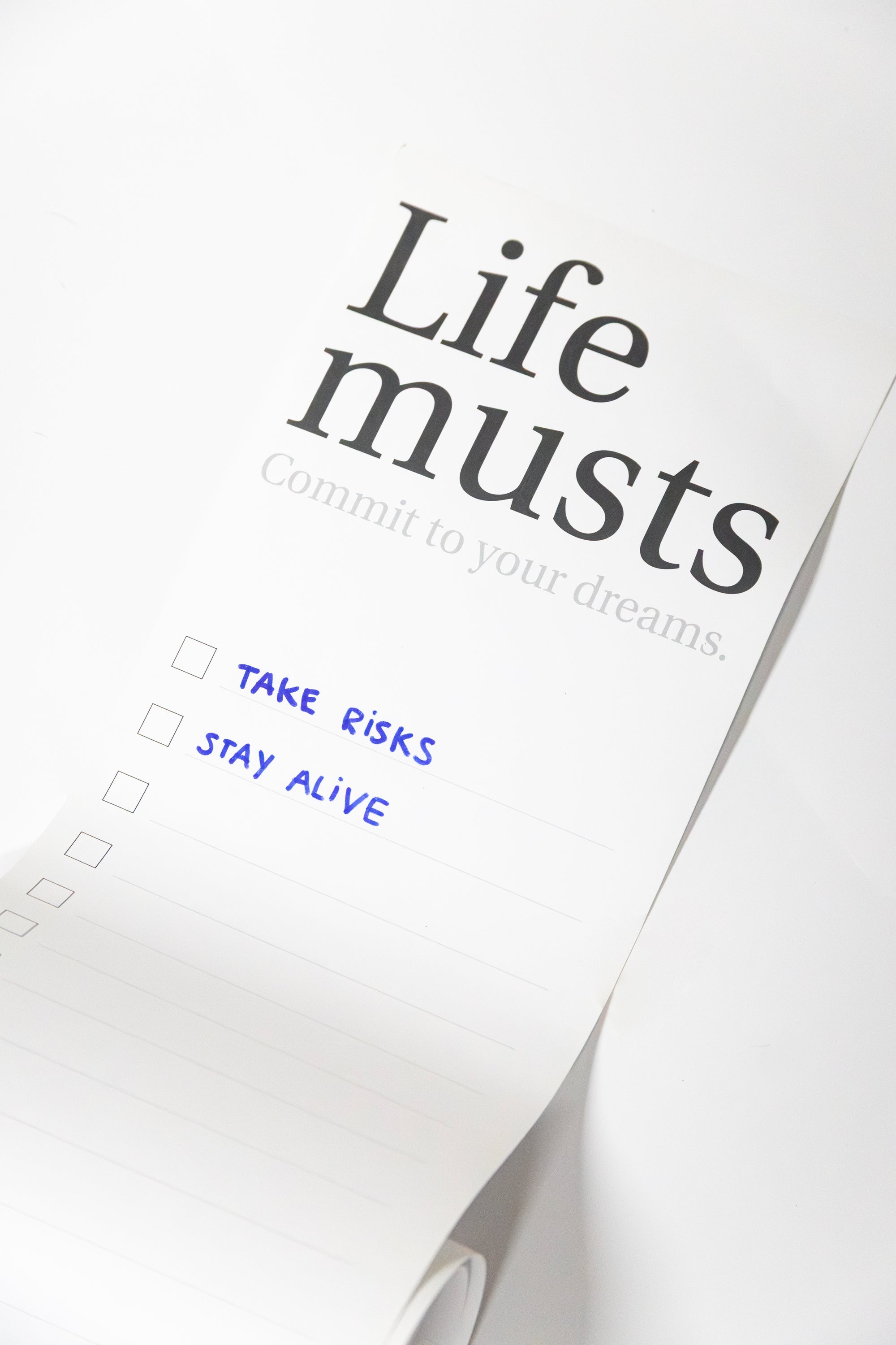 Motivational Life Musts poster and checkboxes on a white background
