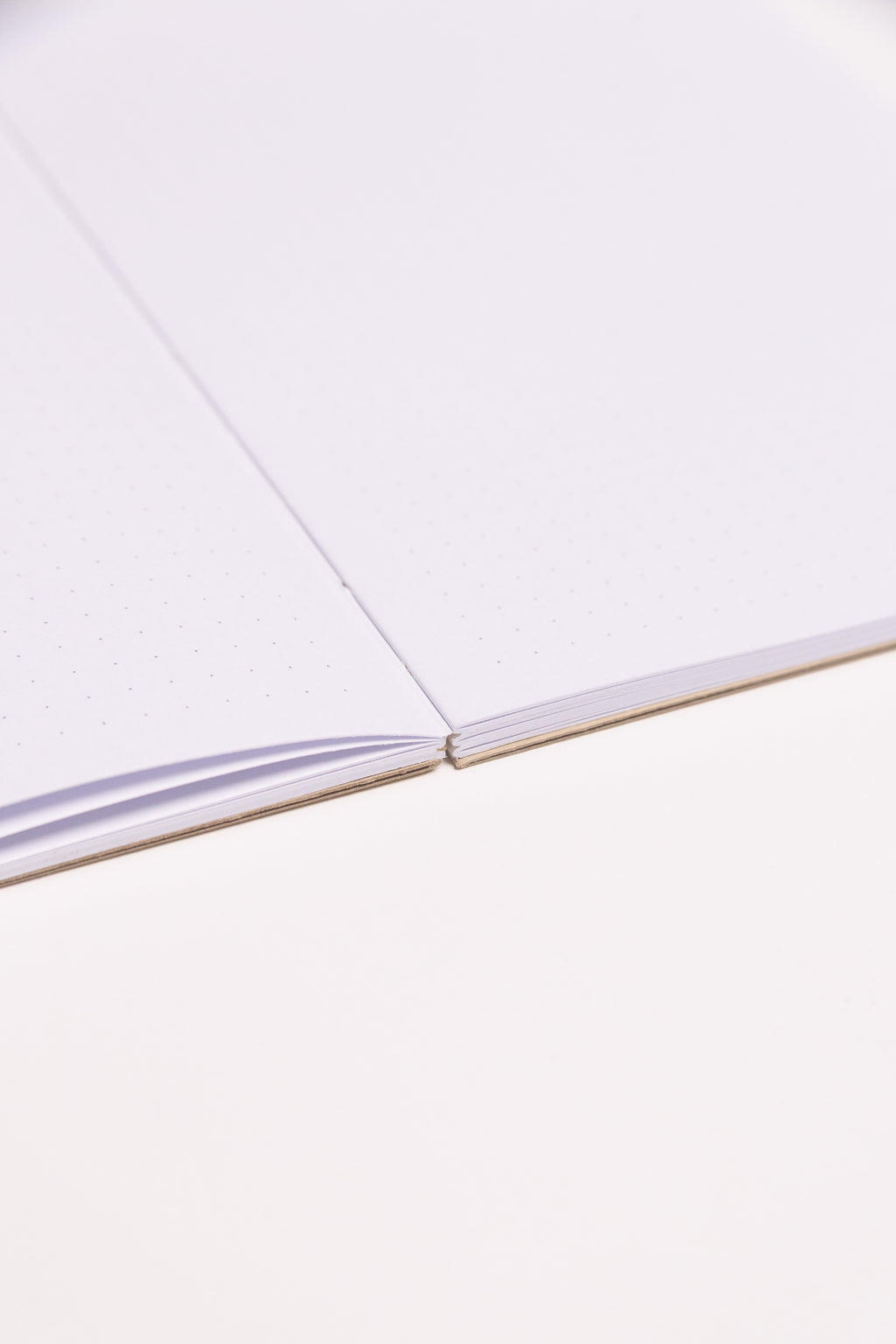 Open Spine Notebook 13,5x20 cm (80 pages) · Dotted. Lay-flat opened notebook. Camel color.