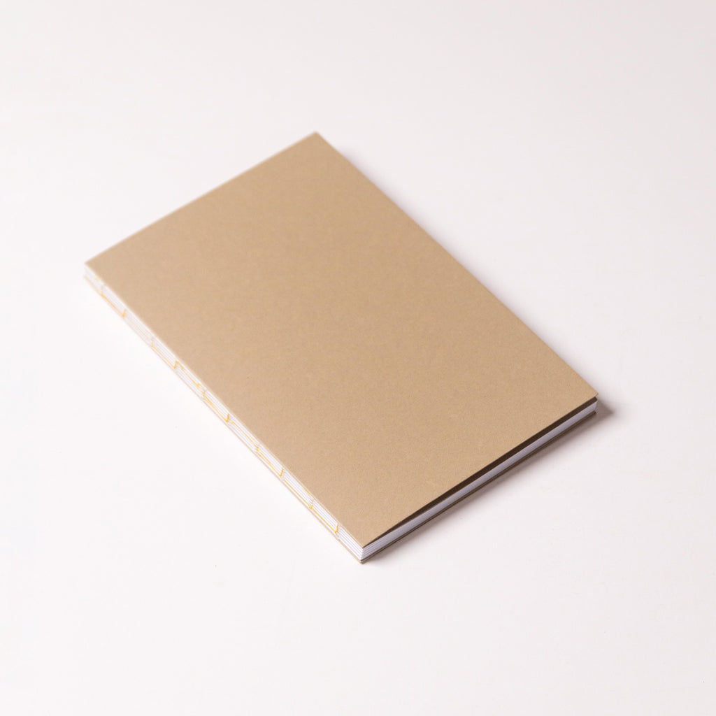 Open Spine Notebook 13,5x20 cm (80 pages) · Dotted. Camel color cover.