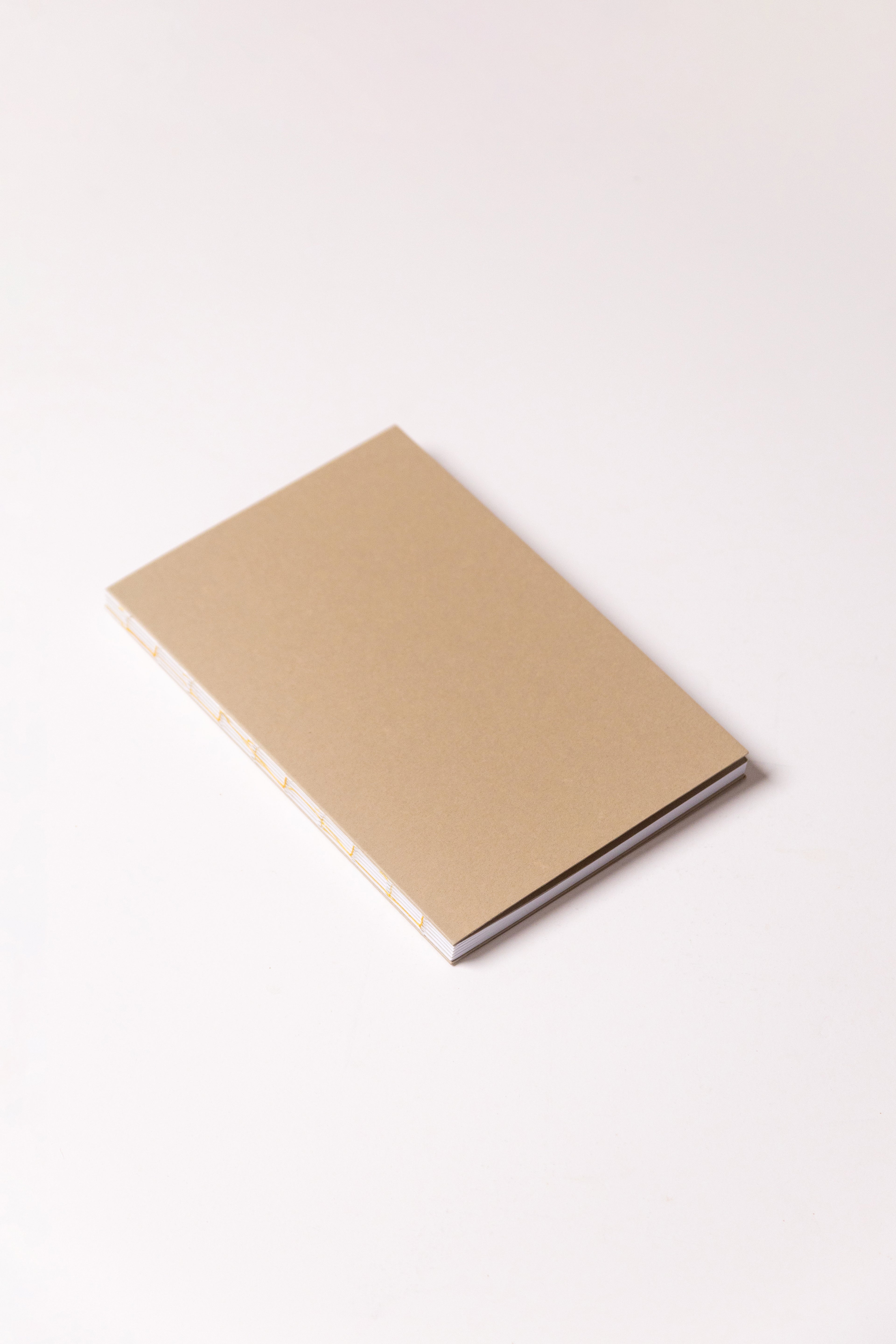 Open Spine Notebook 13,5x20 cm (80 pages) · Dotted. Camel color cover.