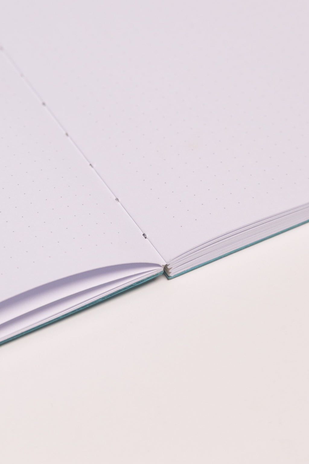 Open Spine Notebook 13,5x20 cm (80 pages) · Dotted. Lay-flat opened notebook.  Caribbean Blue color.