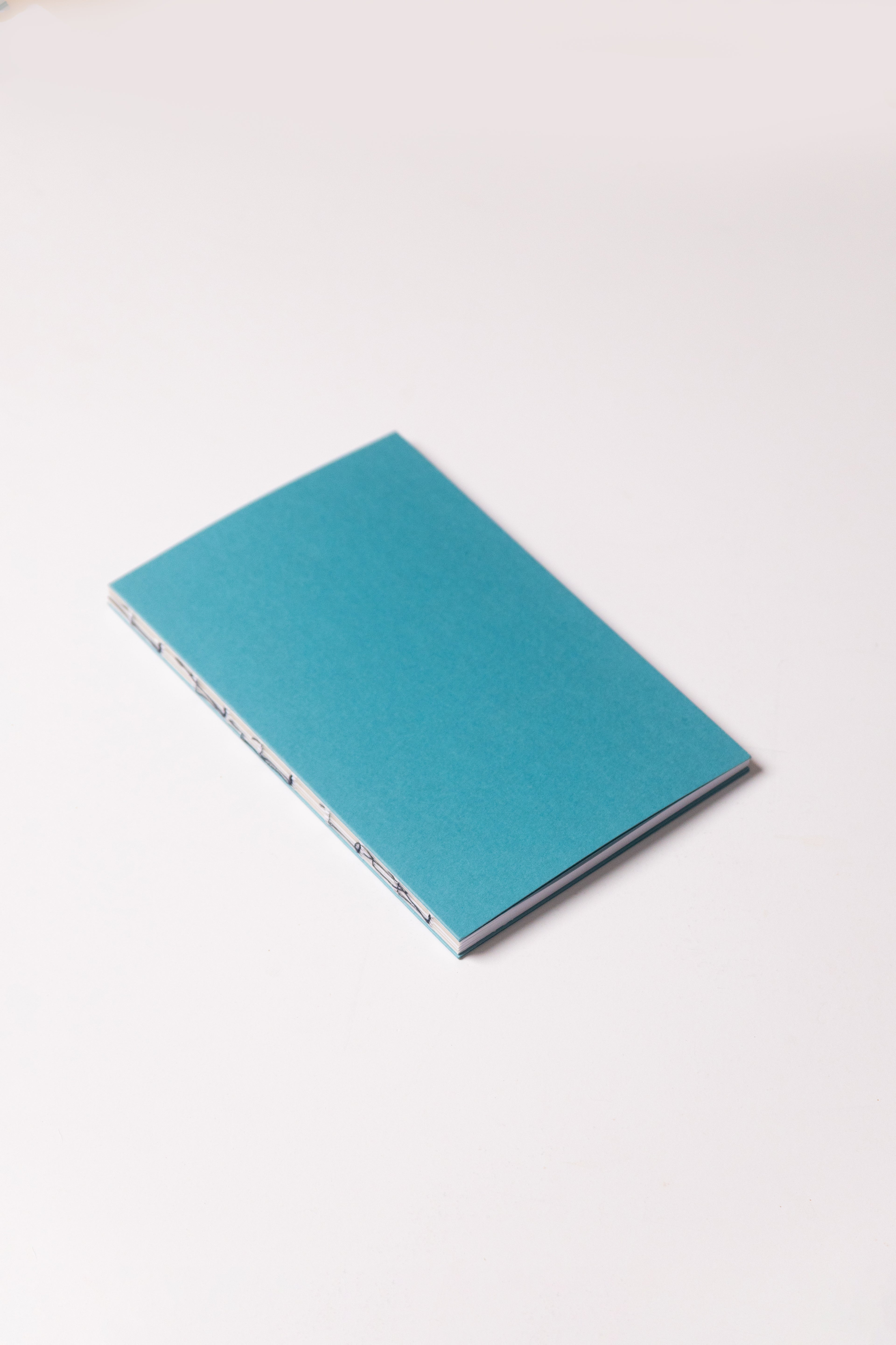 Open Spine Notebook 13,5x20 cm (80 pages) · Dotted. Caribbean Blue cover.
