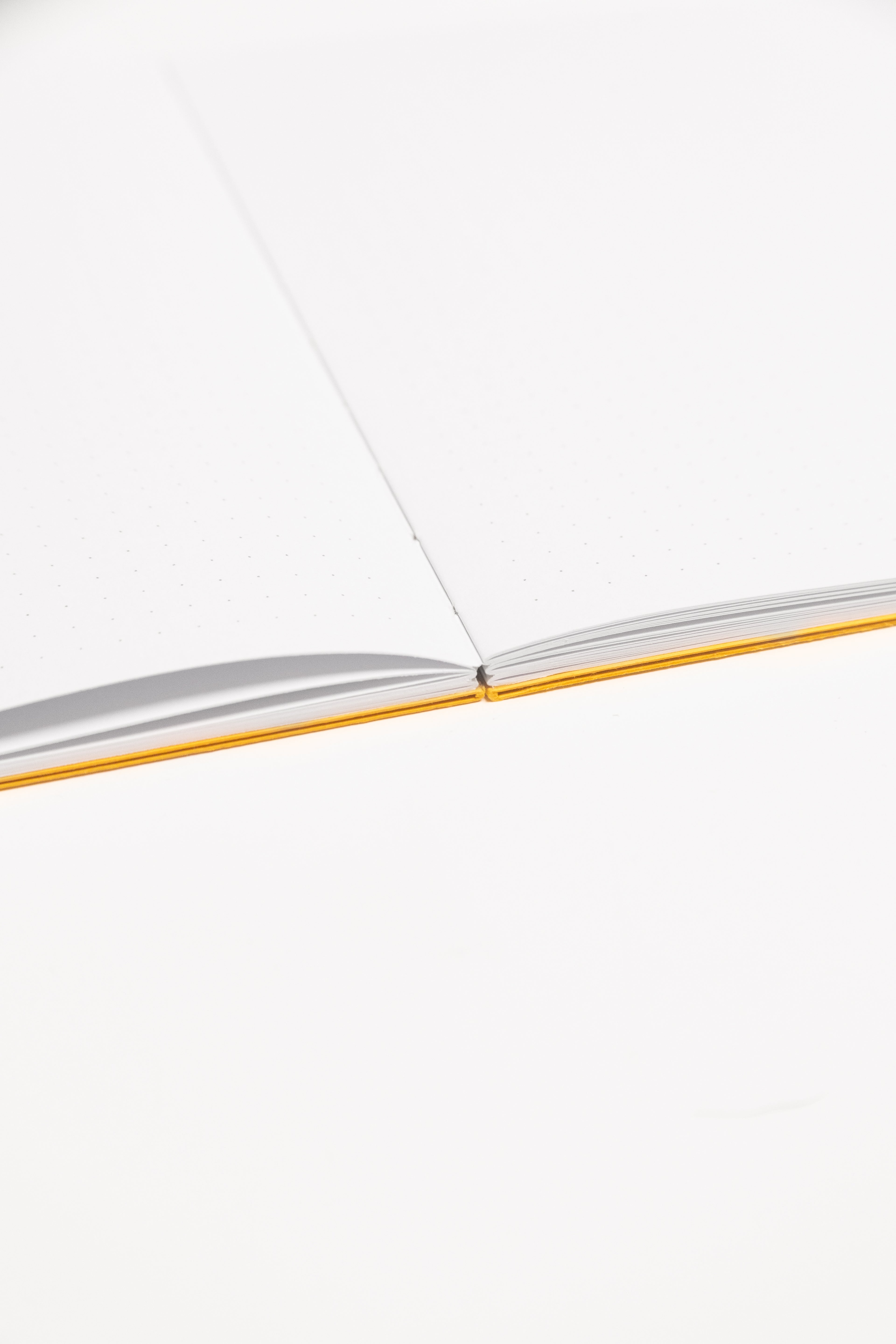 Open Spine Notebook 13,5x20 cm (80 pages) · Dotted. Lay-flat opened notebook. Indian Yellow color.