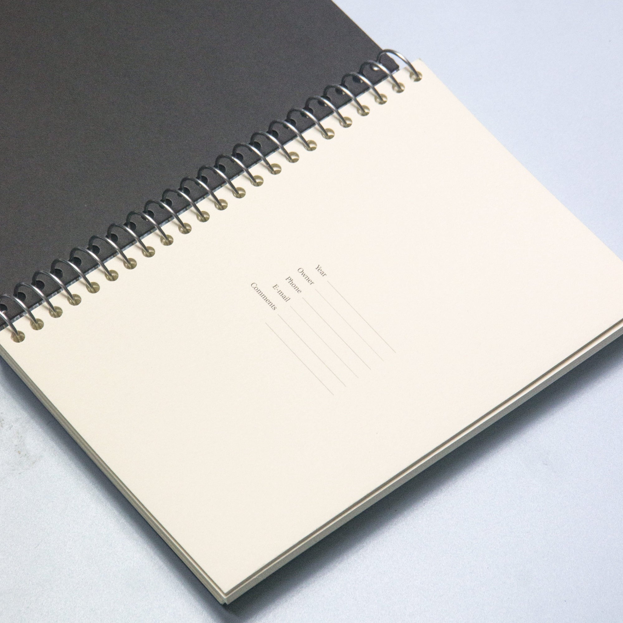 CUSTOM · Spiral notebook · Black · 144 pages · Similar A5