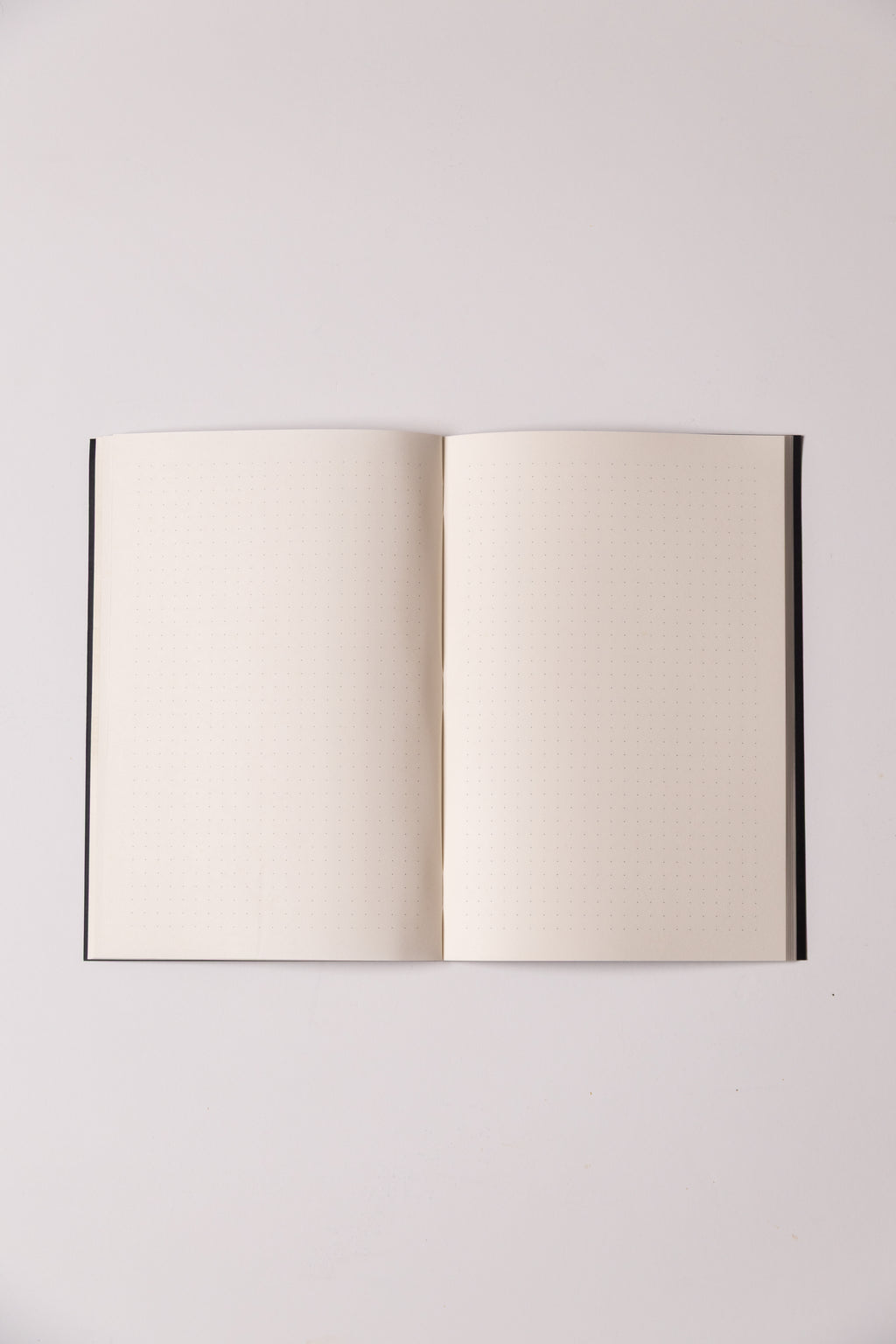 Black Dotted Notebook 13.5x20 cm (A5) | Octàgon Design. Dotted paper inner pages.