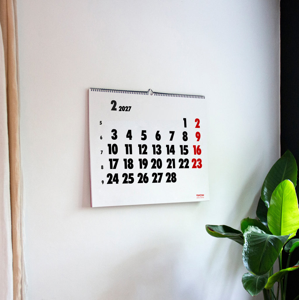 2027 Vinçon wall Calendar by Octàgon Design. The Vinçon calendar hanging on a wall.
