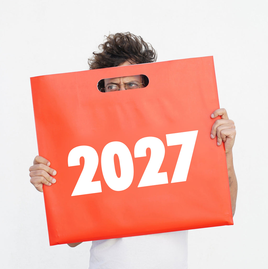 2027 Vinçon wall Calendar by Octàgon Design. A boy holding the bag of the calendar.