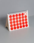 OCTÀGON DESIGN | 2024 Vinçon Desk Calendar | Page with round red stickers