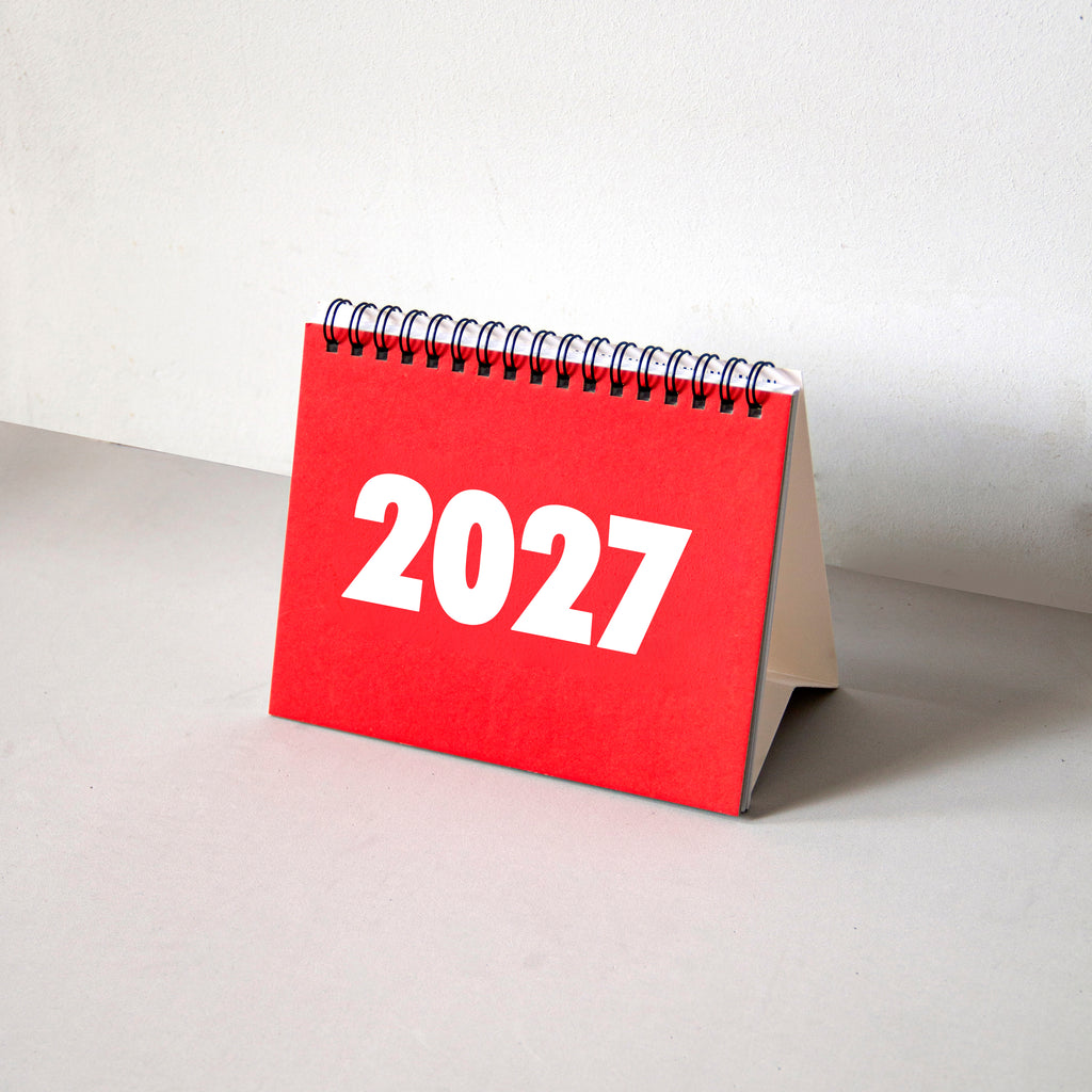 2027 Vinçon desk calendar by Octàgon Design. The calendar on a table.