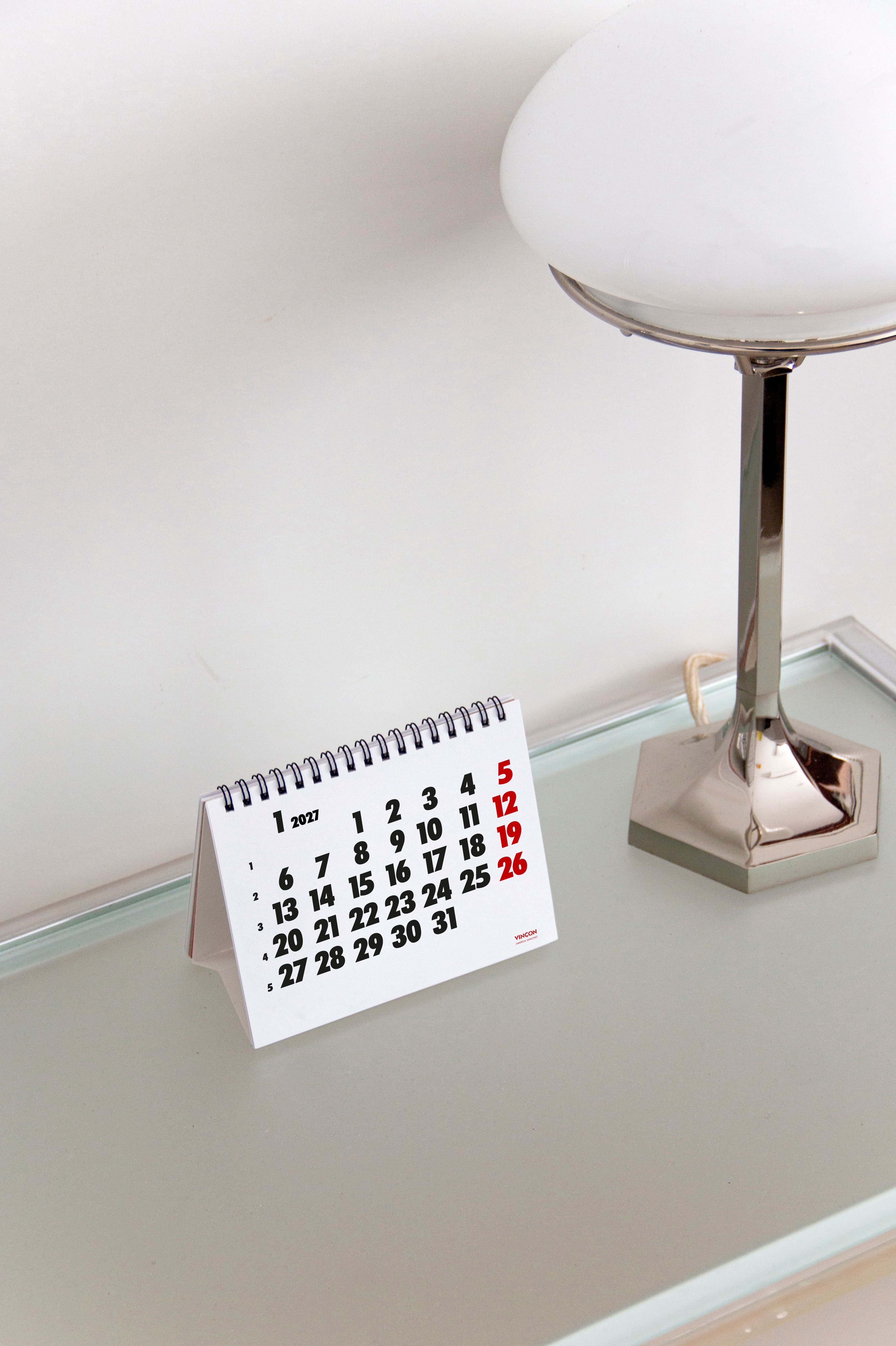 2027 Vinçon desk calendar by Octàgon Design. The calendar on a table. Home atmosphere.