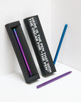 OCTÀGON DESIGN | "Drop Pen" metallics rainbow, purple and blue color pens and black pen box with "Here is the pen that won the Oscar for "THE PEN" print white colour.