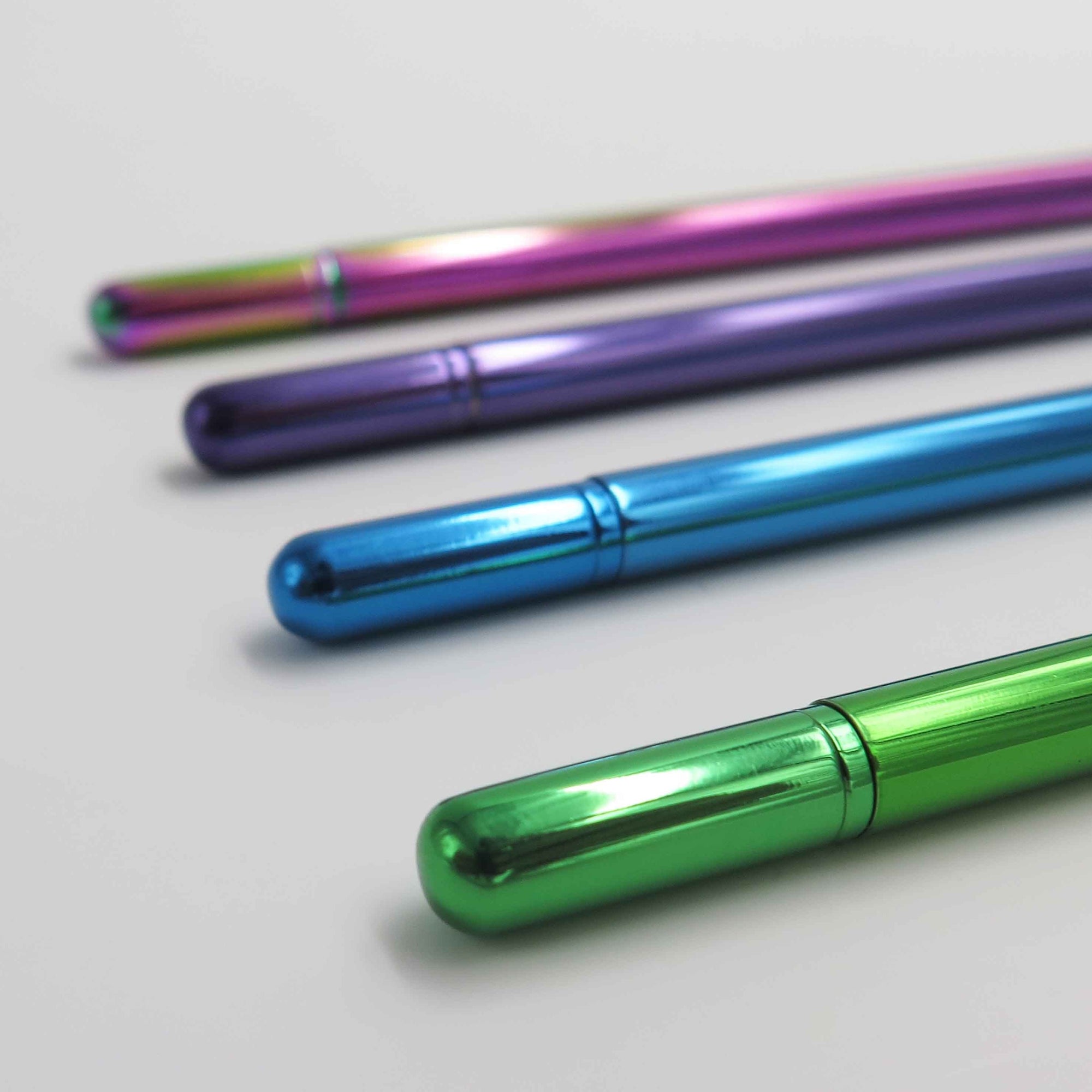 OCTÀGON DESIGN | "Drop pen" collection. Blue, purple, green and rainbow pen colors.