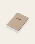 "Draw" mini notebook, brown cover and brown typography.