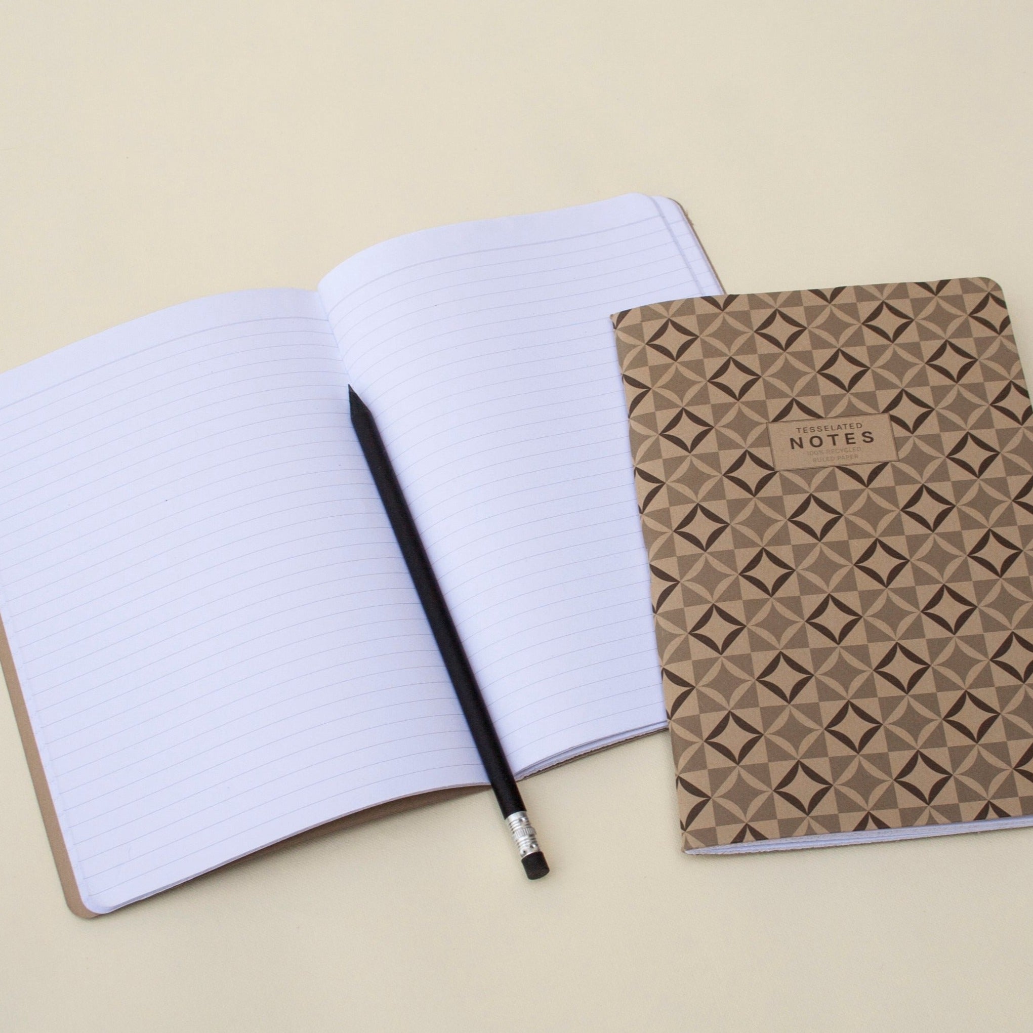 Open "Notes" lined notebook. And "Notes" notebook, brown cover.| OCTÀGON DESIGN 