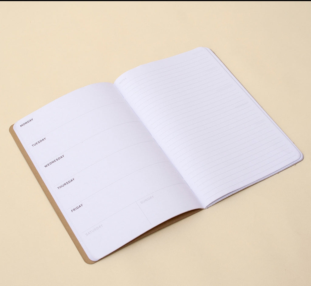 Open "Planner" weekly planner, the left page is a weekly template and the right page is ruled for notes.| OCTÀGON DESIGN 