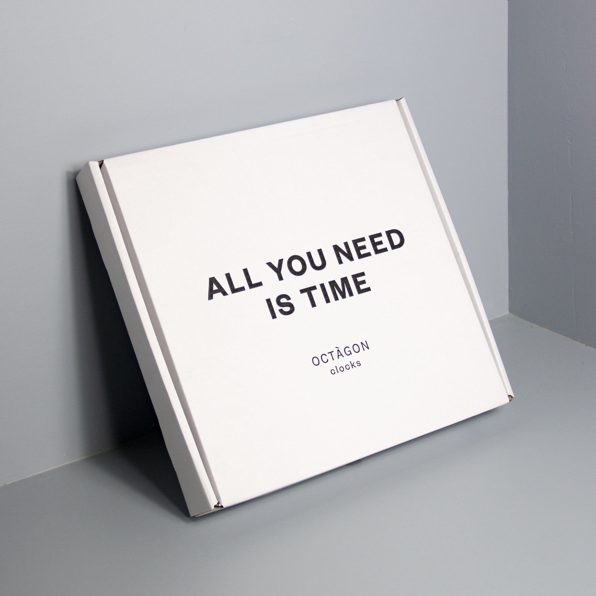 White clock box with "All you need is time" print black colour.